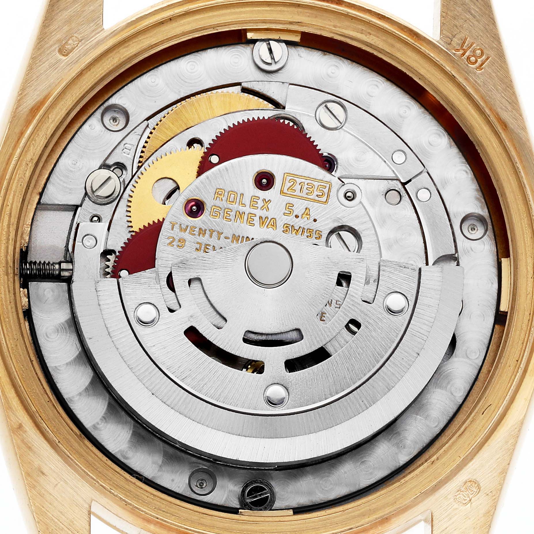 The image shows the movement parts of a Rolex President 68278 Women's Yellow Gold White Dial 68278 Women's Yellow Gold White Dial model, viewed from the back, highlighting gears and mechanisms.
