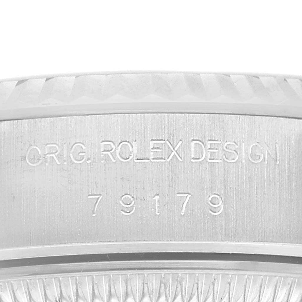 The image shows an angled close-up of the case side of a Rolex President 79179 Women's White Gold Silver Dial 79179 Women's White Gold Silver Dial model watch, highlighting the engraved design and model number.