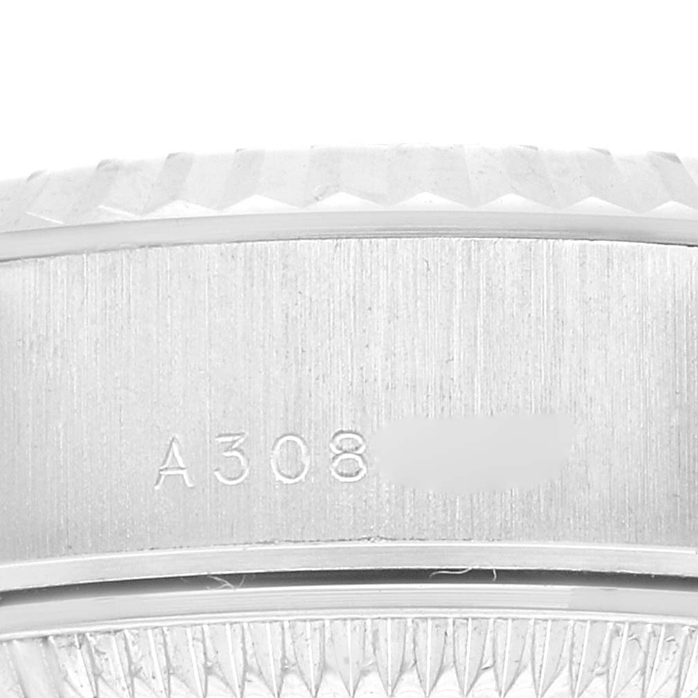 This image shows a close-up of the case side and bezel of a Rolex President 79179 Women's White Gold Silver Dial 79179 Women's White Gold Silver Dial model watch, with a partial serial number visible.