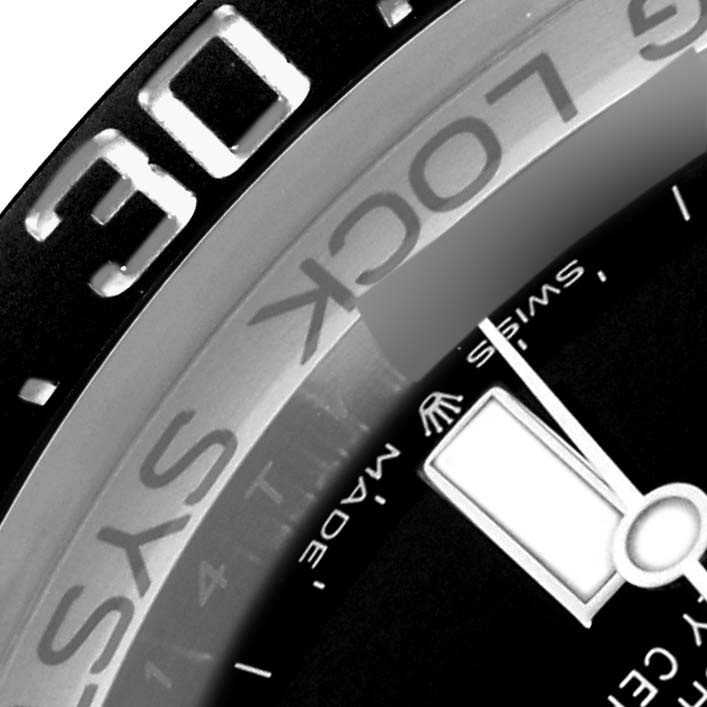 The image shows a partial close-up of the Rolex Sea-Dweller 126660 Men
s Stainless Steel Blue Dial 126660 Men
s Stainless Steel Blue Dial
s bezel and dial, highlighting details like the "LOCK" and markers.