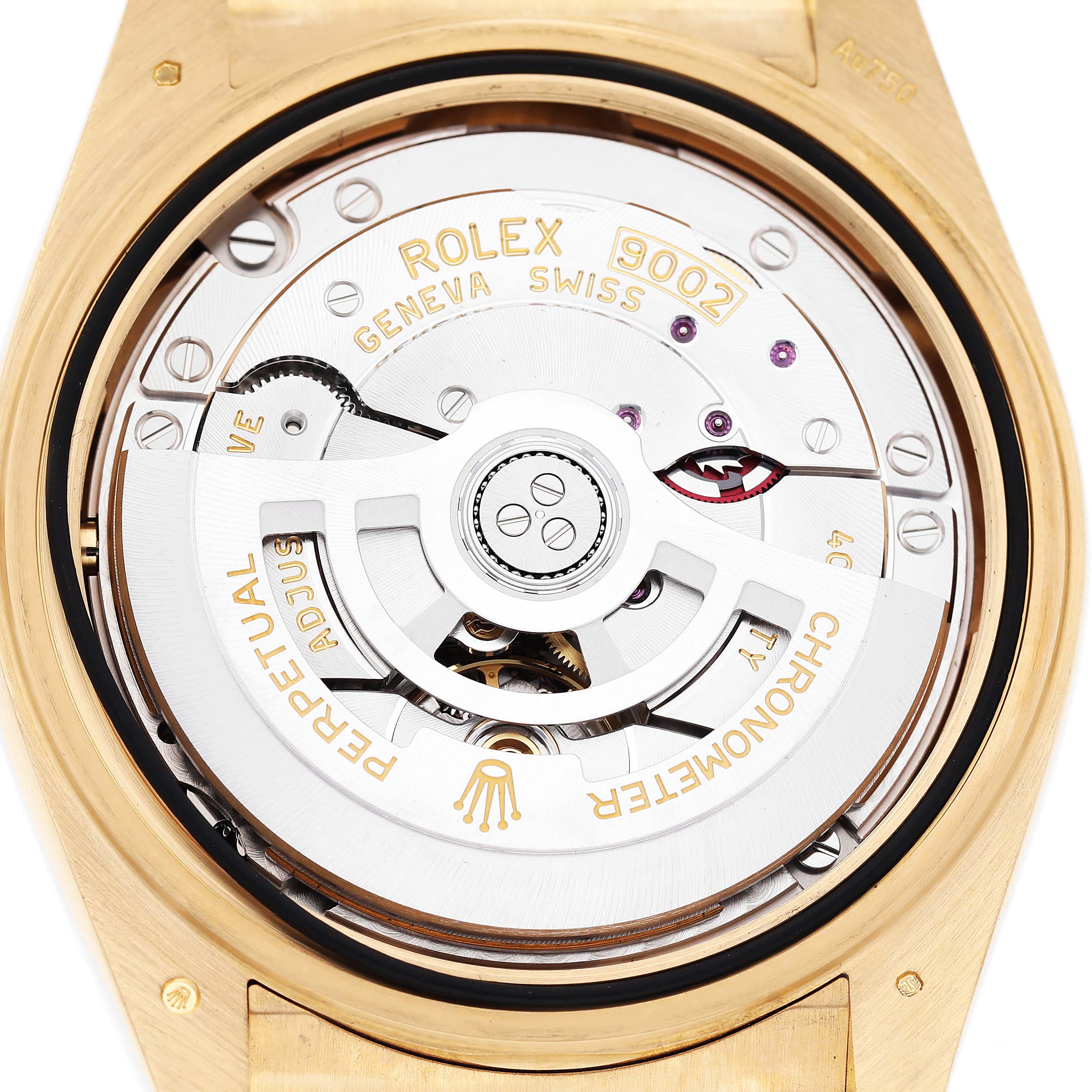 The image shows a close-up of the movement inside a Rolex Sky-Dweller 336238 Men's Yellow Gold White Dial, highlighting the rotor and engraving details.