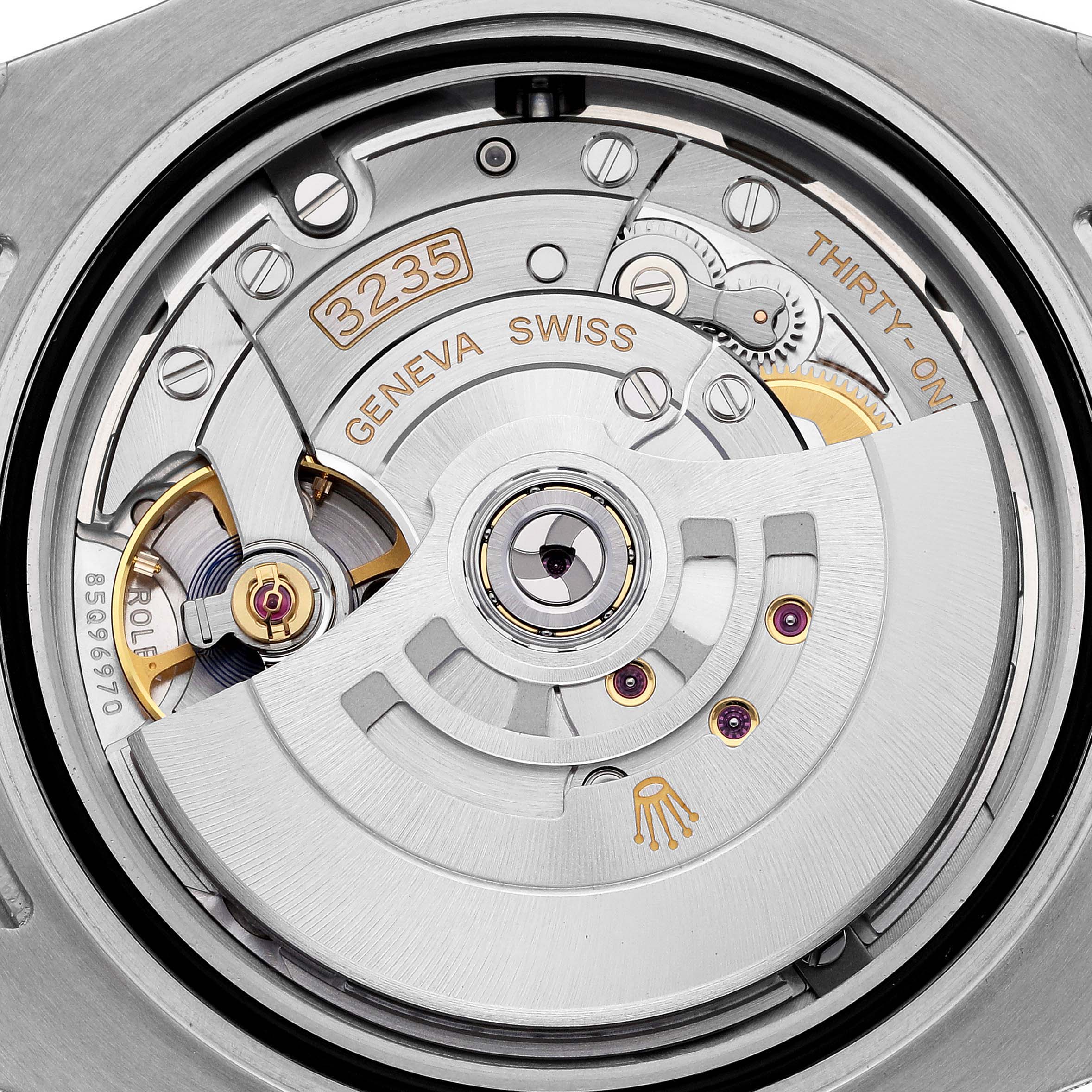 The image shows the movement of a Rolex Submariner 126613LB Men's Steel and Gold (two tone) Blue Dial 126613LB Men's Steel and Gold (two tone) Blue Dial, highlighting its internal mechanical components.