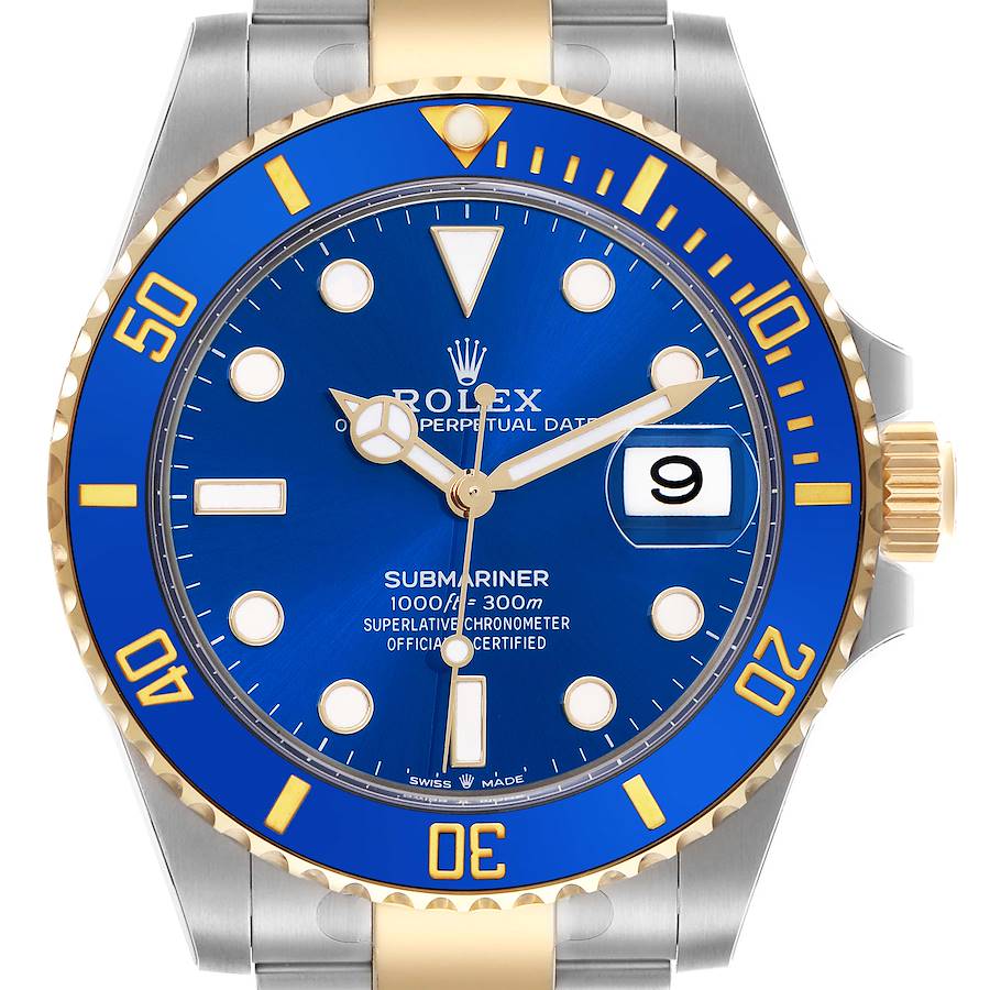 The Rolex Submariner is shown from the front, highlighting the blue dial, bezel, hands, markers, and date window at 3 o'clock.