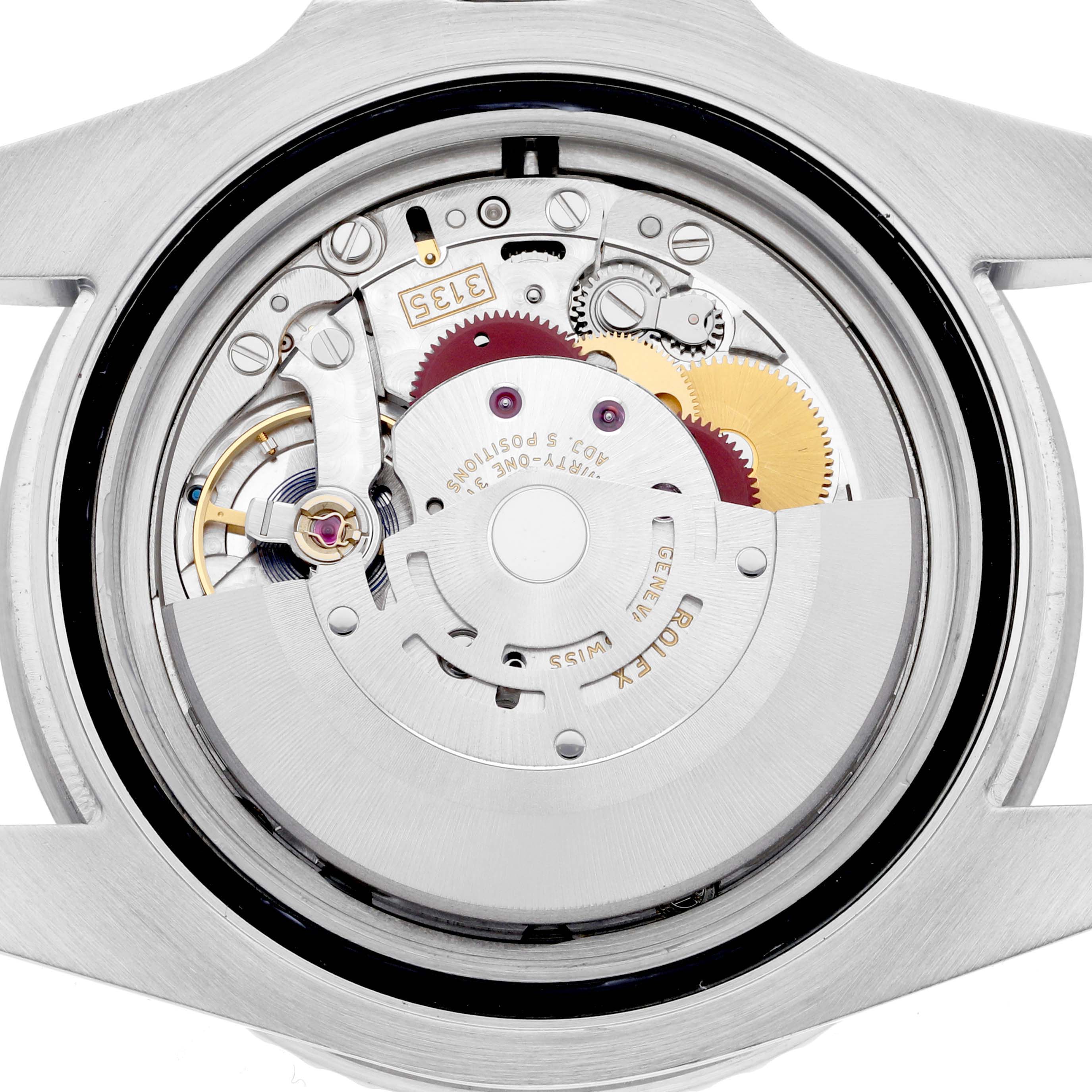 The image shows the movement of a Rolex Submariner 116610LN Men's Stainless Steel Black Dial 116610LN Men's Stainless Steel Black Dial watch from the back, highlighting its intricate gears and components.