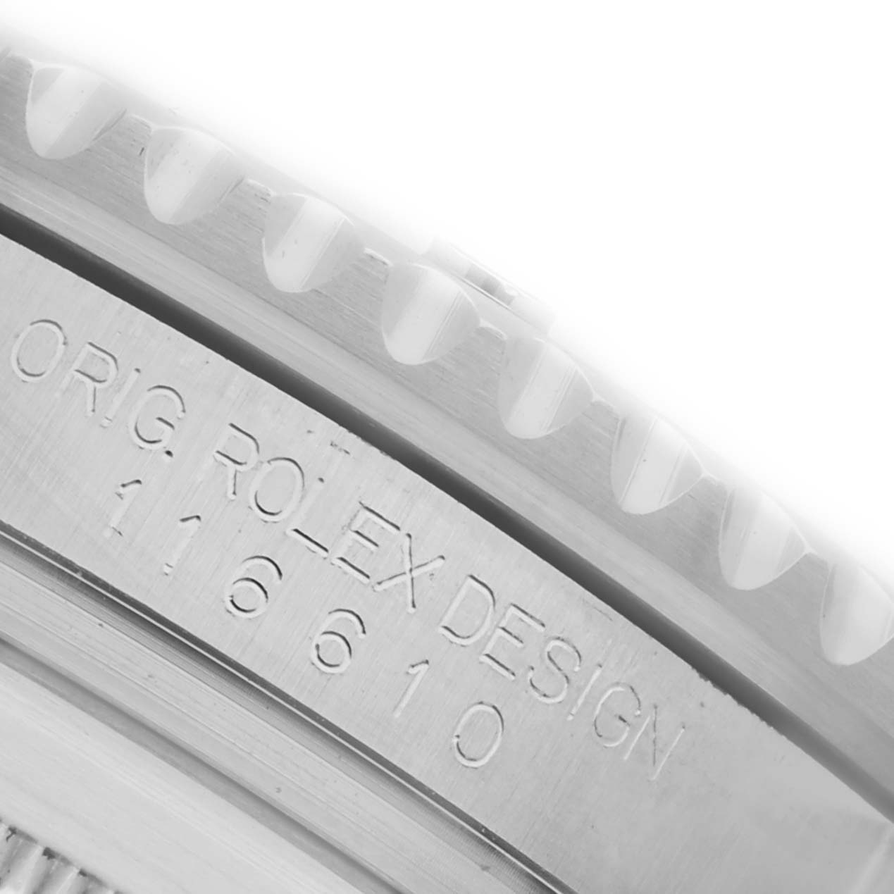 The image shows a close-up of the side engraving on the bezel of a Rolex Submariner 116610LN Men's Stainless Steel Black Dial 116610LN Men's Stainless Steel Black Dial.