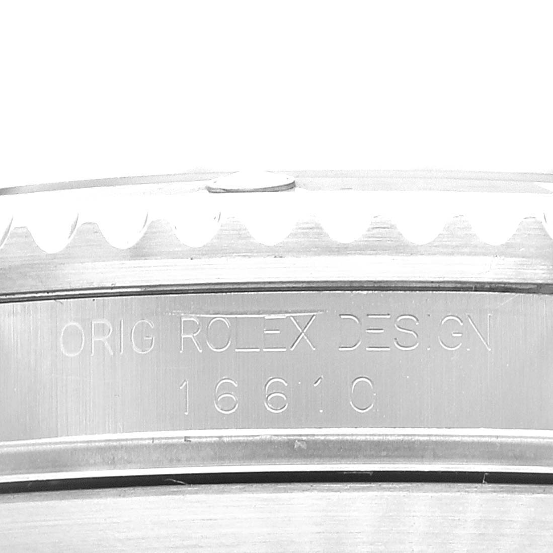 The image shows a close-up of the case side of a Rolex Submariner 16610 Men's Stainless Steel Black Dial 16610 Men's Stainless Steel Black Dial, displaying the engraved model number 16610.