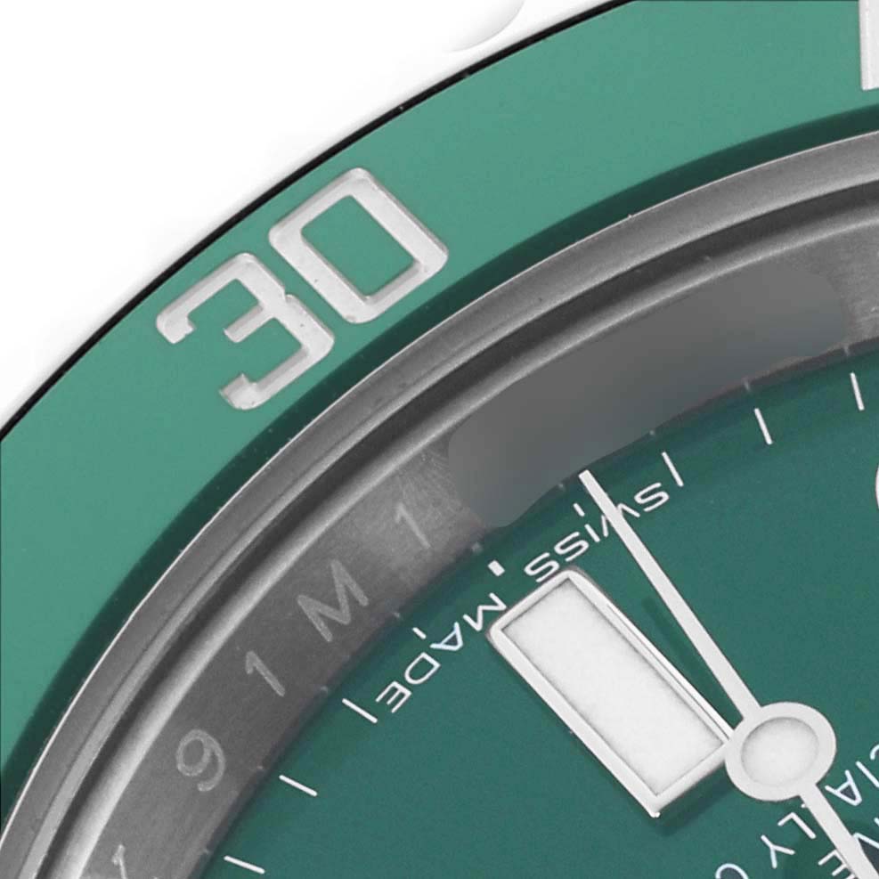 The image shows a close-up of the bezel and dial of a Rolex Submariner 116610LV Men's Stainless Steel Green Dial 116610LV Men's Stainless Steel Green Dial, highlighting the green color and the "30" minute mark.