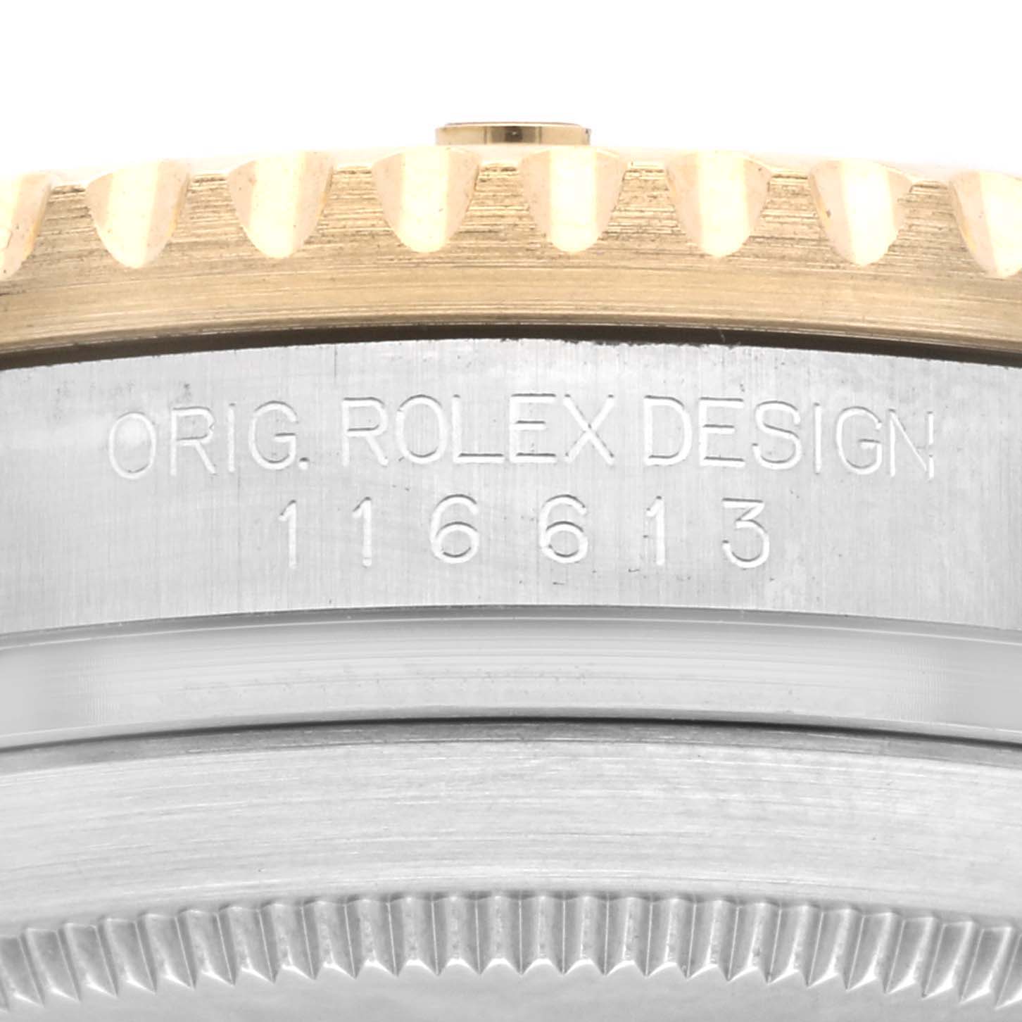 This image shows a close-up of the side engraving and bezel of a Rolex Submariner 116613LN Men
s Steel and Gold (two tone) Black Dial 116613LN Men
s Steel and Gold (two tone) Black Dial watch, model 116613.