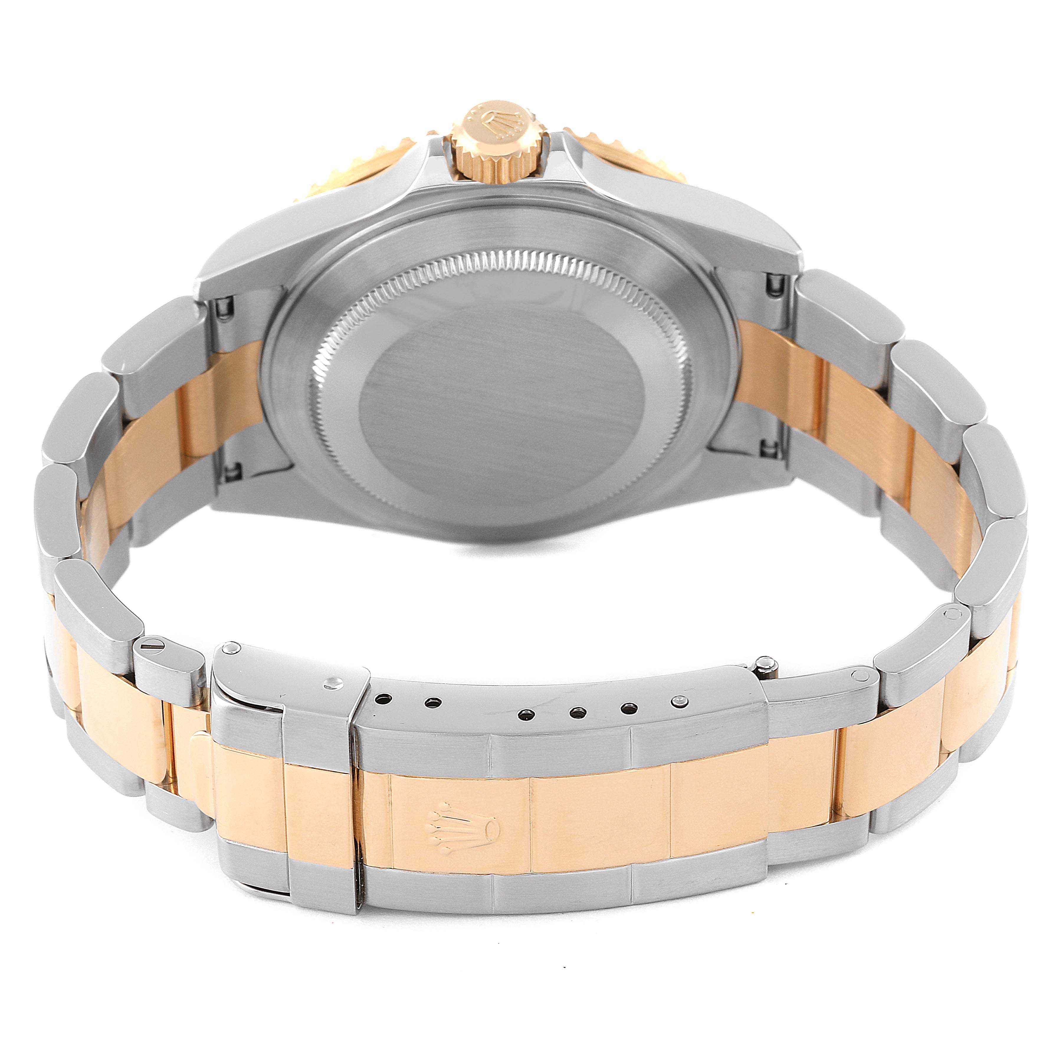 This image shows the back view of a Rolex Submariner 16613 Men's Steel and Gold (two tone) Black Dial 16613 Men's Steel and Gold (two tone) Black Dial watch, highlighting the case back, crown, and two-tone bracelet.