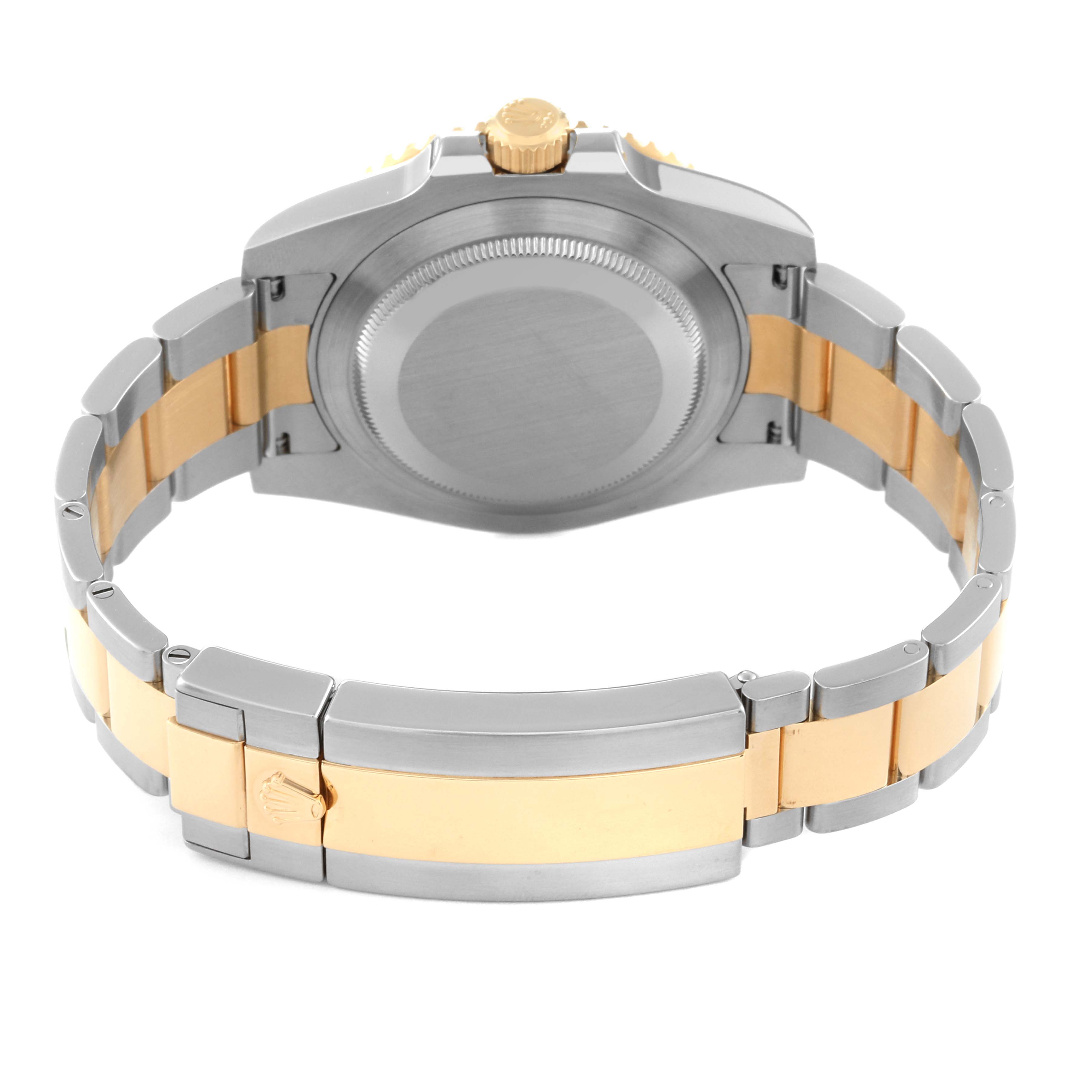 The image shows the back and bracelet of a Rolex Submariner 116613 Men
s Steel and Gold (two tone) Black Dial 116613 Men
s Steel and Gold (two tone) Black Dial watch, featuring a two-tone metal finish.
