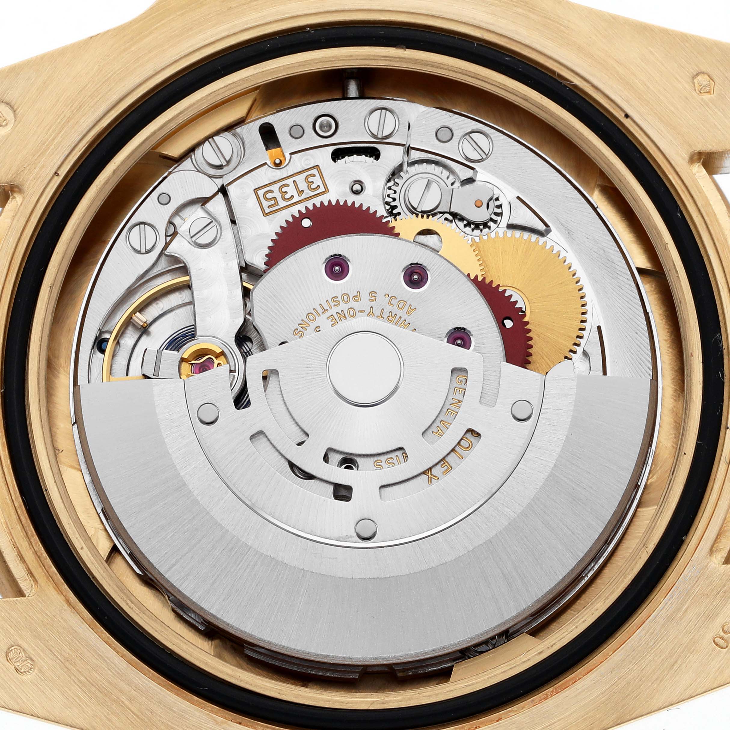 The image shows the internal movement mechanism of a Rolex Submariner 116618LB Men's Yellow Gold Blue Dial 116618LB Men's Yellow Gold Blue Dial watch from a back view, highlighting gears and components.