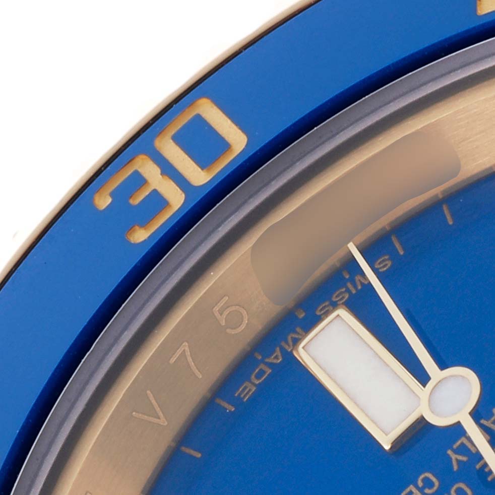 The image shows a close-up of the bezel and dial of a Rolex Submariner 116618LB Men's Yellow Gold Blue Dial 116618LB Men's Yellow Gold Blue Dial, highlighting the 30-minute marker and part of the watch face.