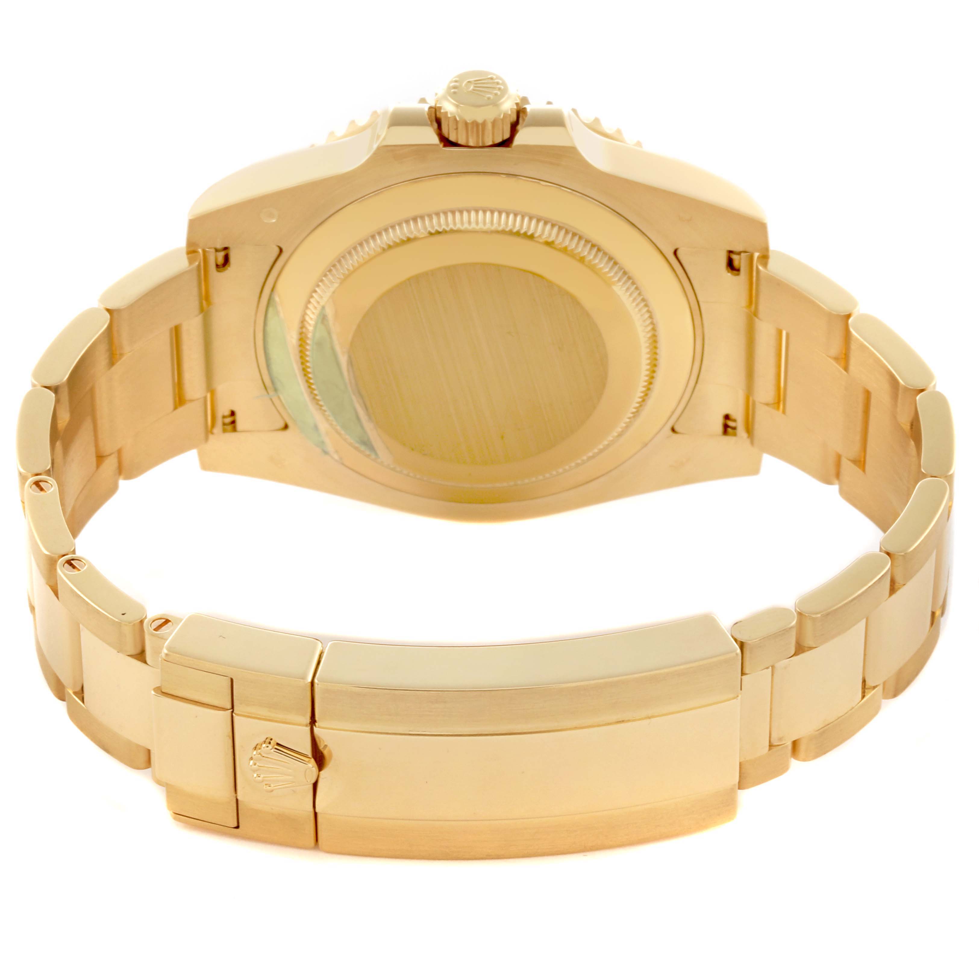 The image shows the back view of a Rolex Submariner 116618LB Men's Yellow Gold Blue Dial 116618LB Men's Yellow Gold Blue Dial watch, highlighting its case, bracelet, and clasp.