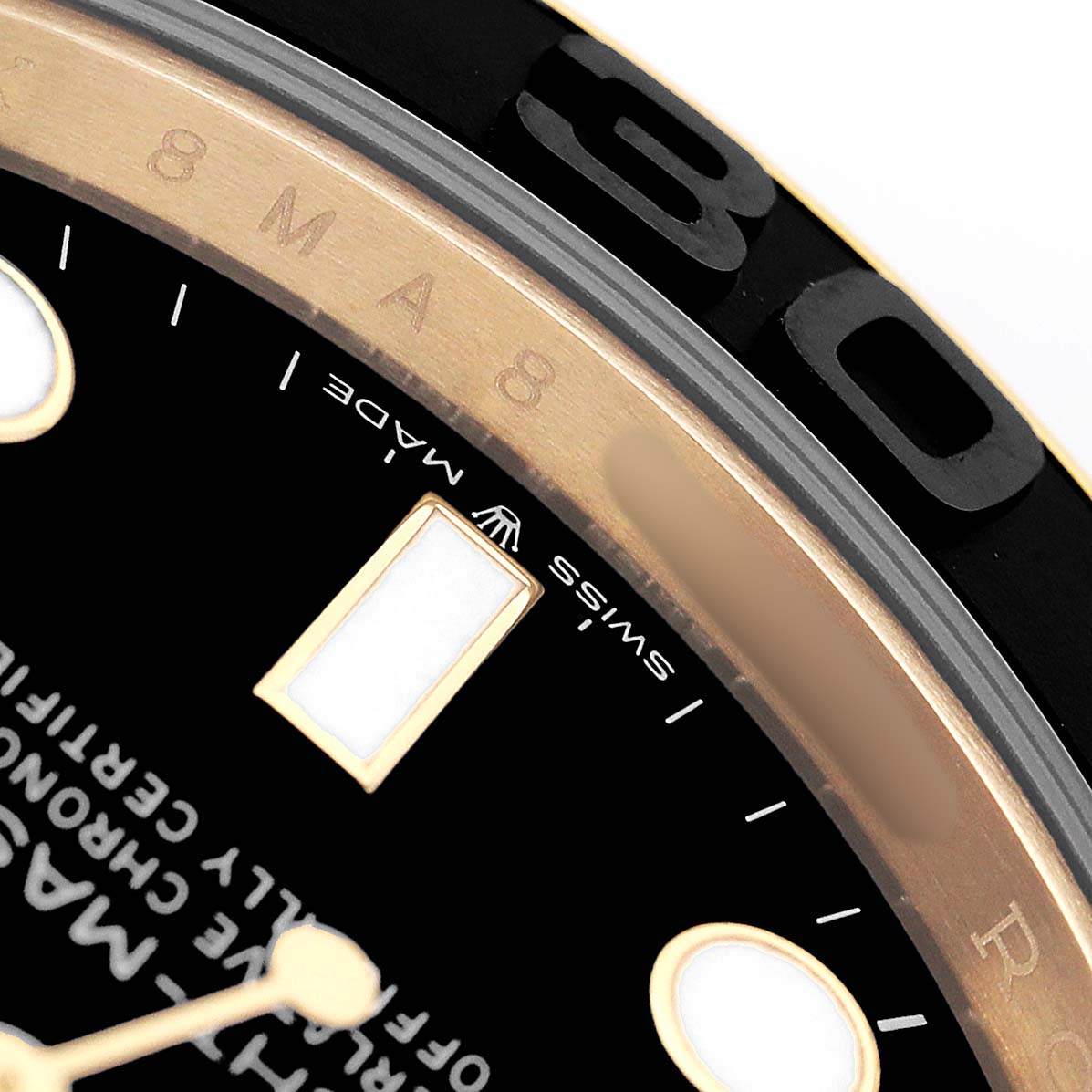 The image shows a close-up of the Rolex Yacht-Master 226658 Men's Yellow Gold Black Dial's dial, bezel, and part of the inscription on the watch face.