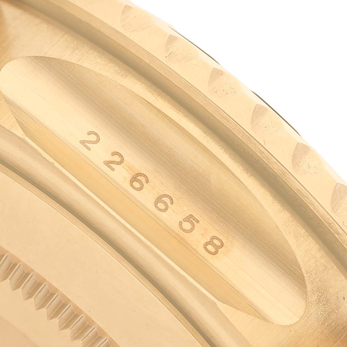 The image shows a close-up of the side of a Rolex Yacht-Master 226658 Men's Yellow Gold Black Dial watch, focusing on the engraved model number on the case.