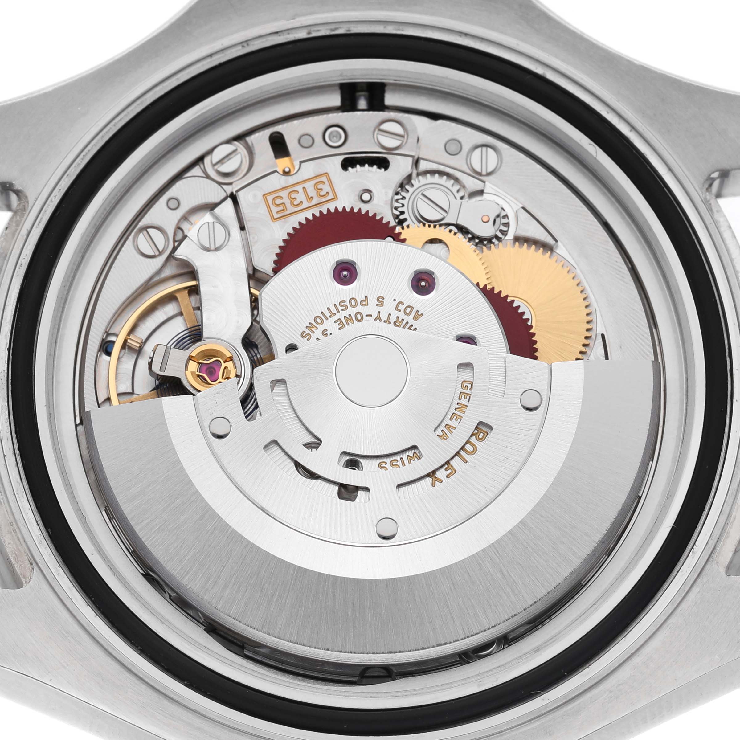 The image shows a close-up view of the open case back of a Rolex Yacht-Master 116622 Men's Stainless Steel Silver Dial, revealing its intricate movement components.
