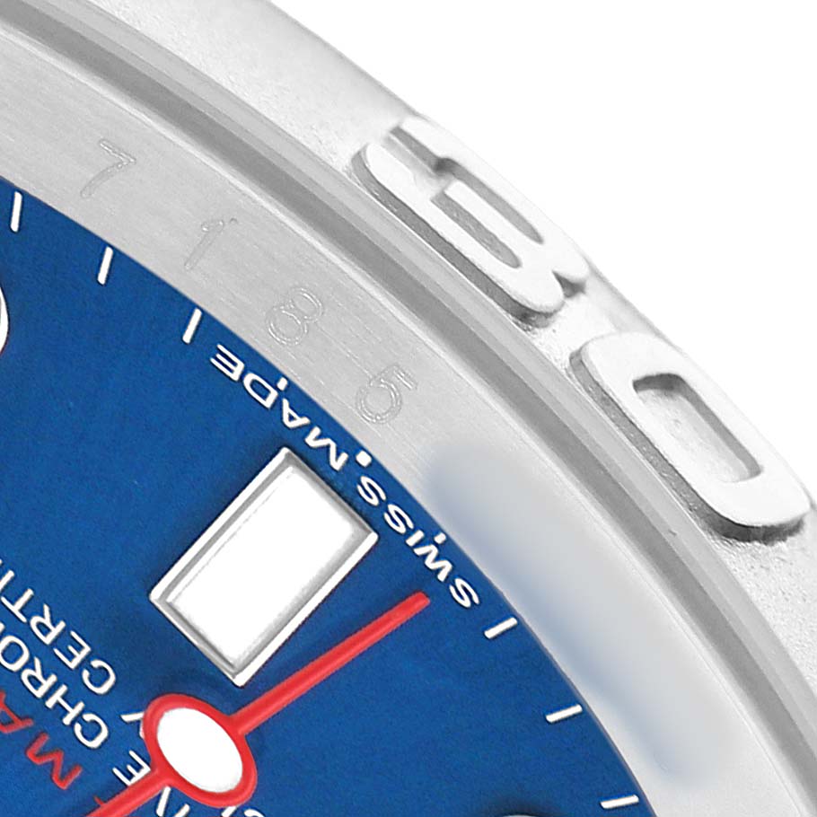 The image shows a close-up of the Yacht-Master by Rolex, highlighting the bezel, part of the dial, and a red hand.