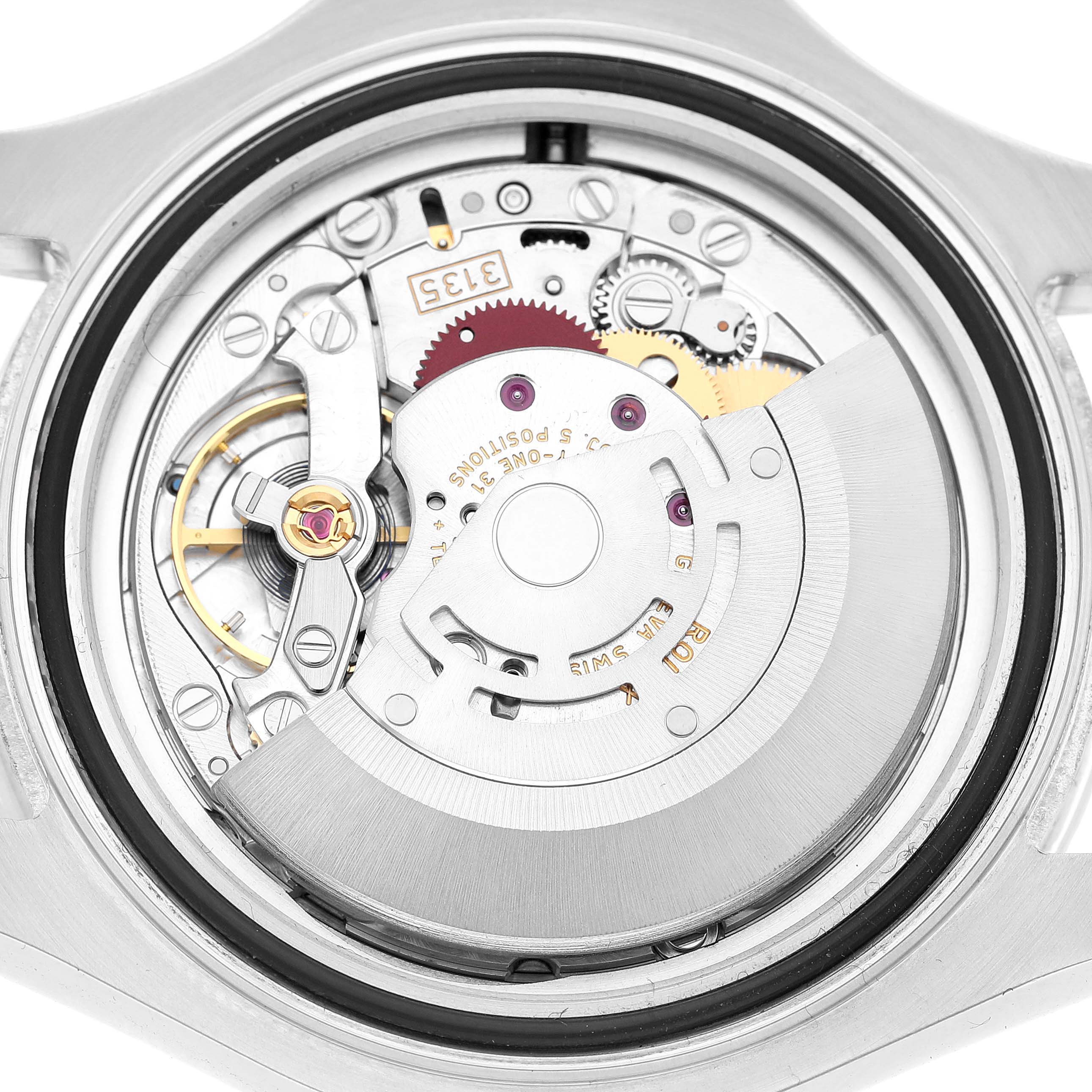 The image shows the movement mechanism of a Rolex Yacht-Master 116622 Men's Stainless Steel Blue Dial watch from a top-down angle, highlighting gears and rotor.