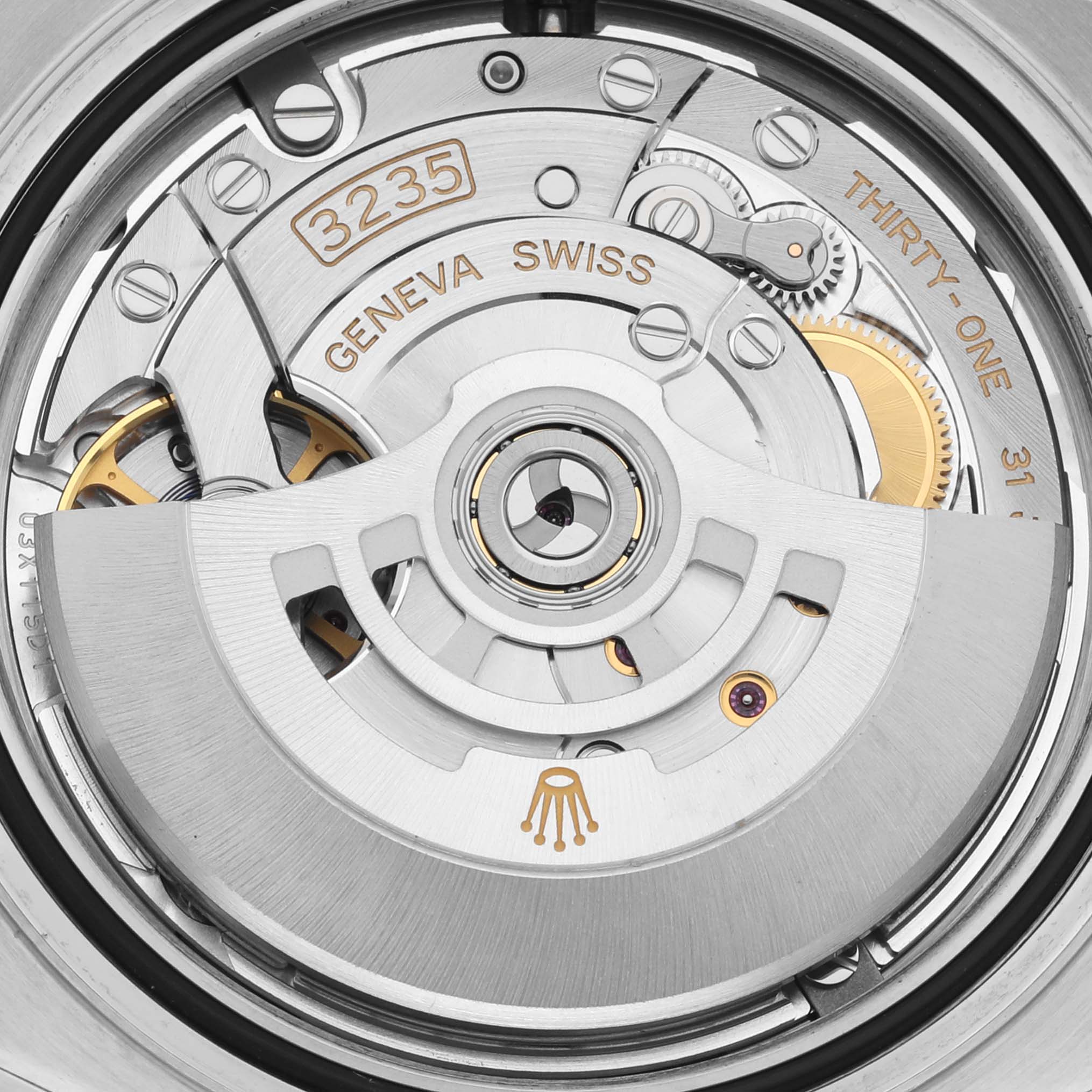 The image shows a close-up of the Yacht-Master Rolex's movement, featuring the rotor and gears from above.