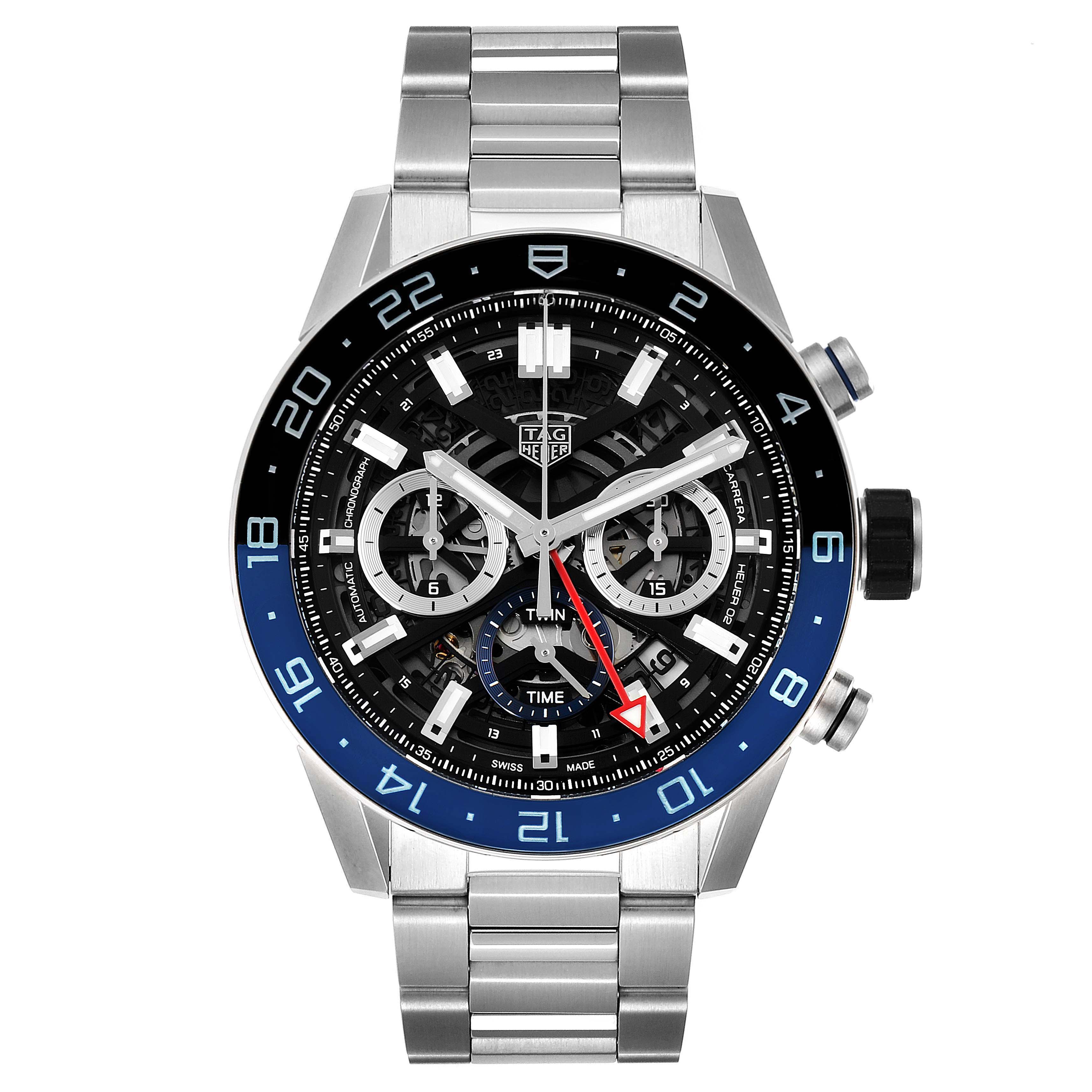 The image shows a frontal view of a Tag Heuer Carrera CBG2A1Z.BA0658 Men
s Stainless Steel Black Dial CBG2A1Z.BA0658 Men
s Stainless Steel Black Dial model watch with a metal strap and a black-and-blue bezel.