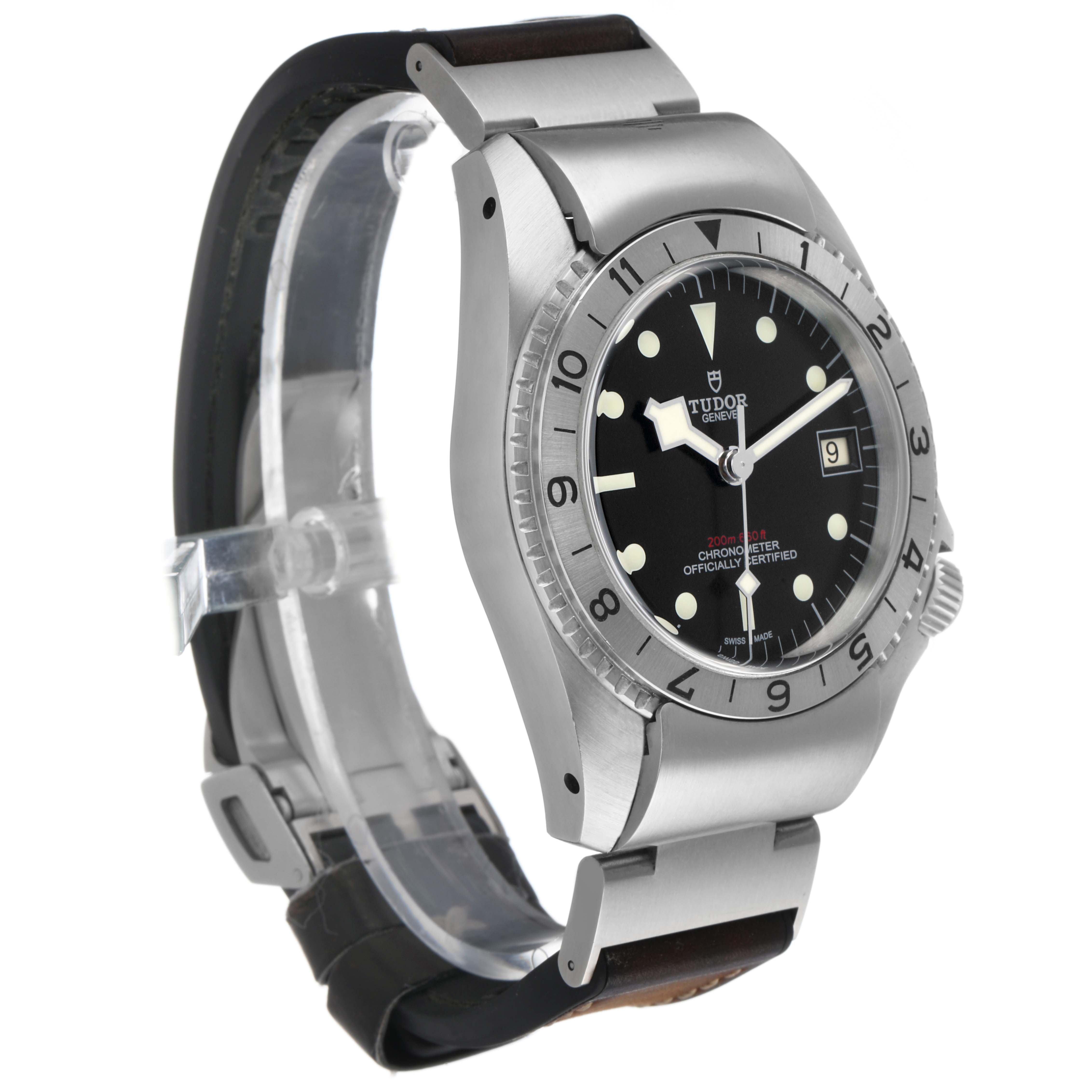The Tudor Heritage Black Bay M70150-0001 Men's Stainless Steel Black Dial watch is shown at a three-quarter angle highlighting the case, bezel, dial, and partially open clasp.