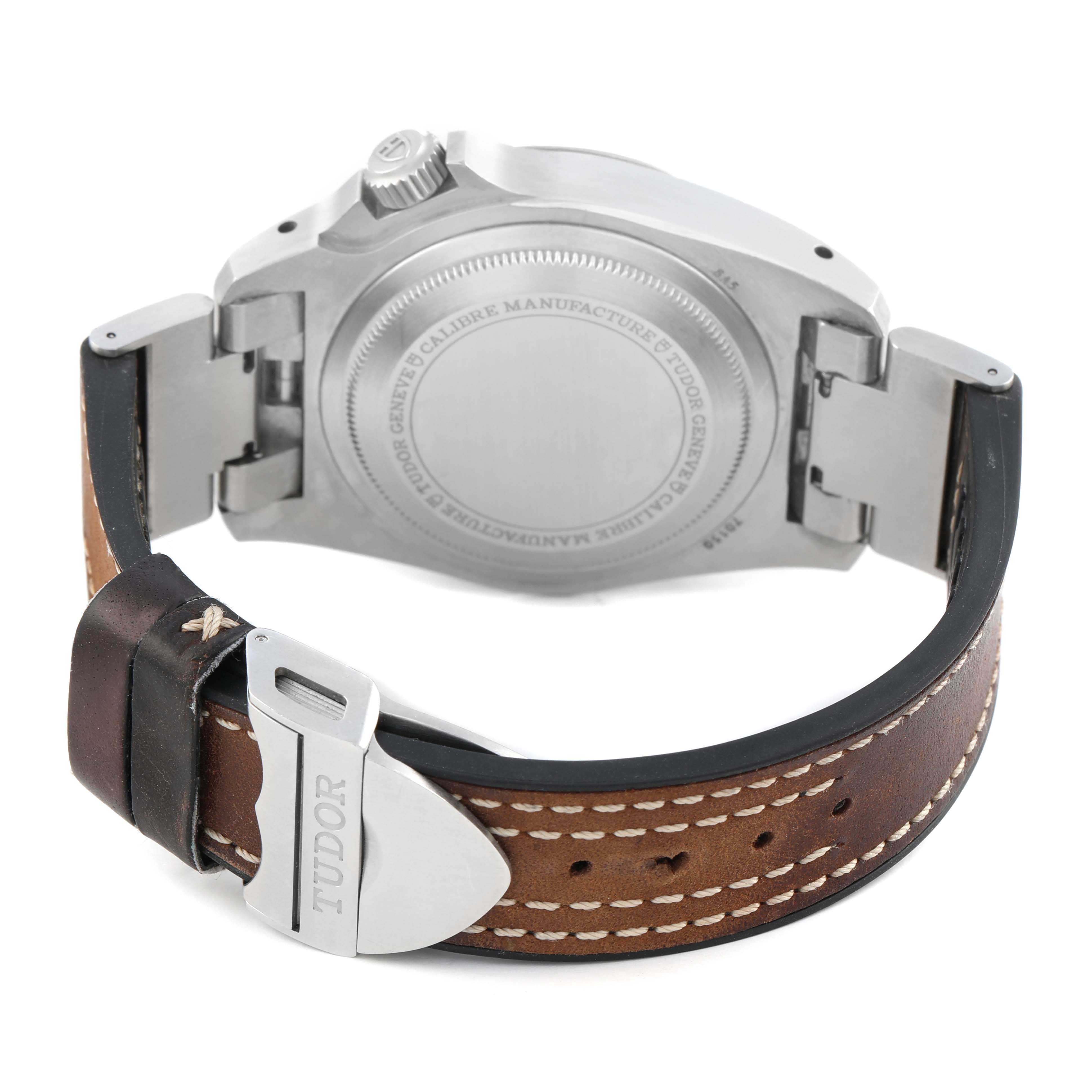 The Tudor Heritage Black Bay M70150-0001 Men's Stainless Steel Black Dial is shown from the back, displaying the case back, crown, and leather strap with clasp.