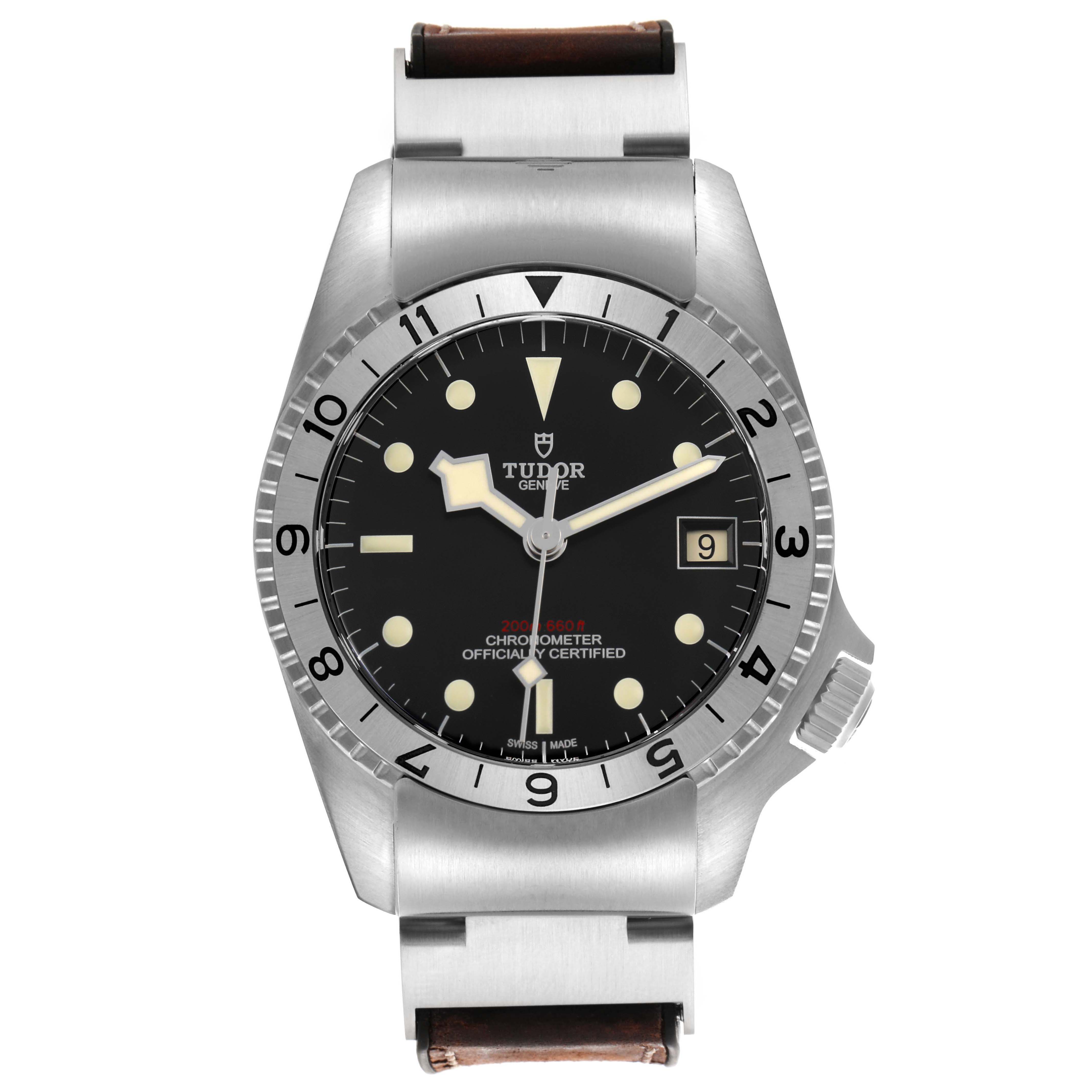 The Tudor Heritage Black Bay M70150-0001 Men's Stainless Steel Black Dial watch is shown from a front angle, highlighting the dial, bezel, and partial bracelet.