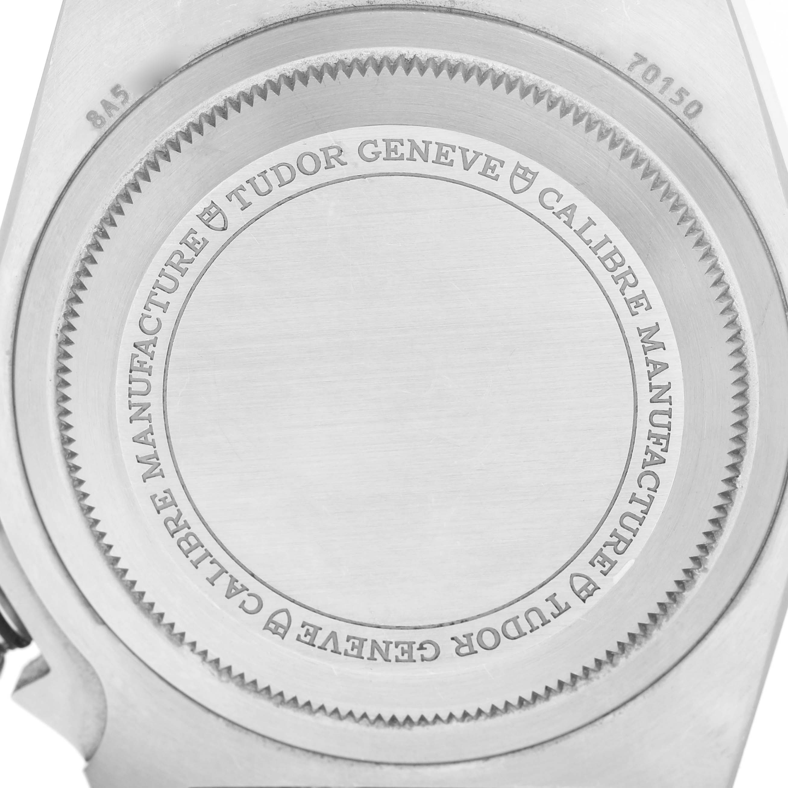 The image shows the case back of the Tudor Heritage Black Bay M70150-0001 Men's Stainless Steel Black Dial watch, focusing on the engraved details and logo.