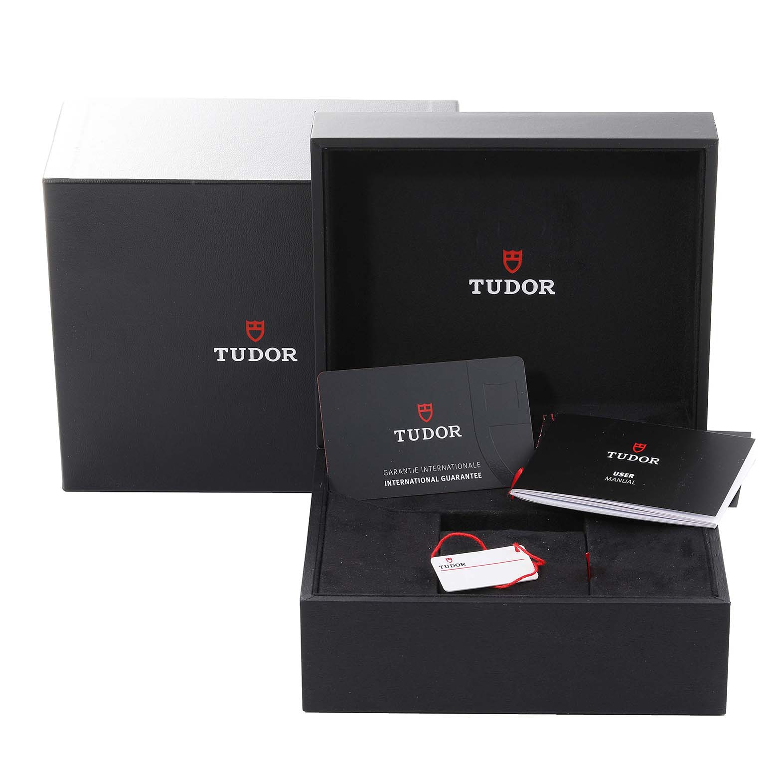 The image shows the outer box, inner box, warranty card, hang tag, and manuals for a Tudor Heritage Black Bay M70150-0001 Men
s Stainless Steel Black Dial M70150-0001 Men
s Stainless Steel Black Dial watch.