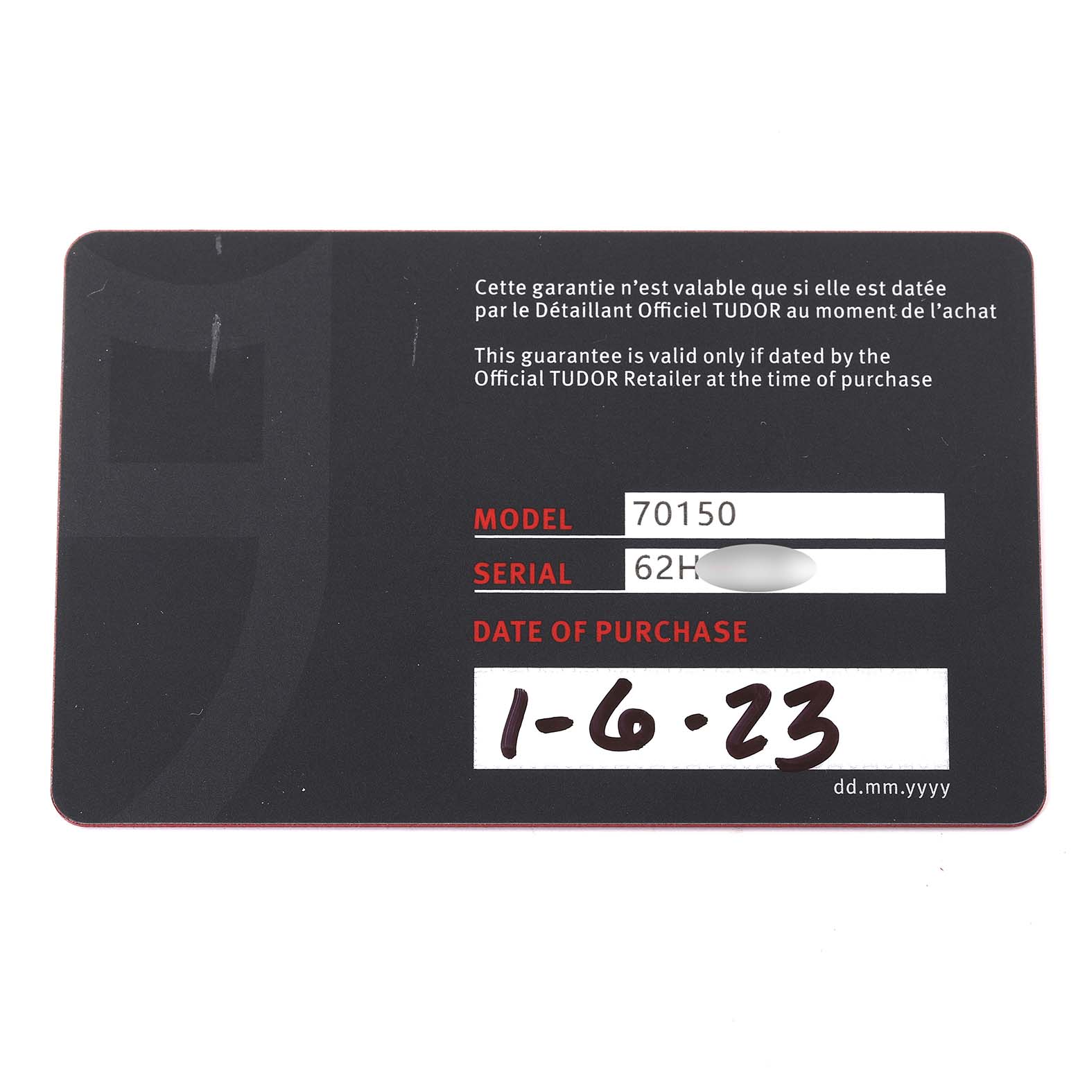 This image shows the warranty card for a Tudor Heritage Black Bay M70150-0001 Men
s Stainless Steel Black Dial M70150-0001 Men
s Stainless Steel Black Dial watch, displaying the model number, serial number, and date of purchase.