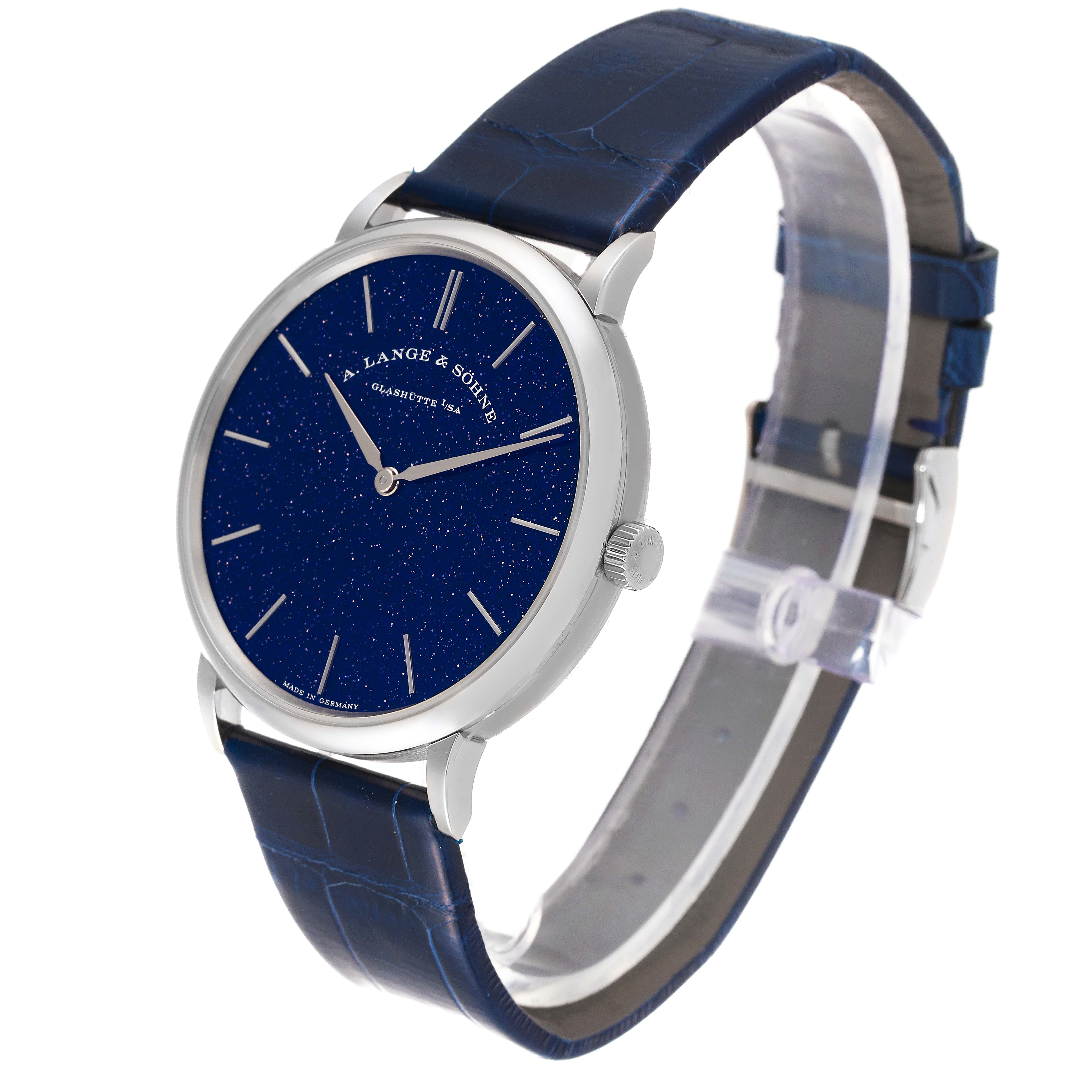 The image shows an A. Lange & Sohne Saxonia 205.086 / LSLS2053AX Men's White Gold Blue Dial watch at a three-quarter angle, highlighting its blue dial and matching leather strap.