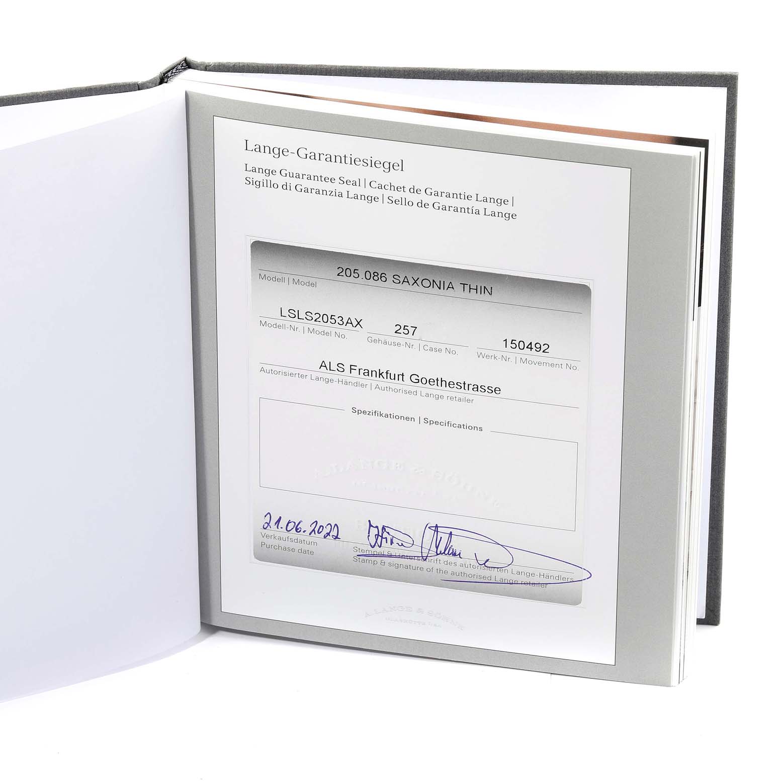 The image shows the warranty card and certification for a Saxonia model by A. Lange & Söhne.