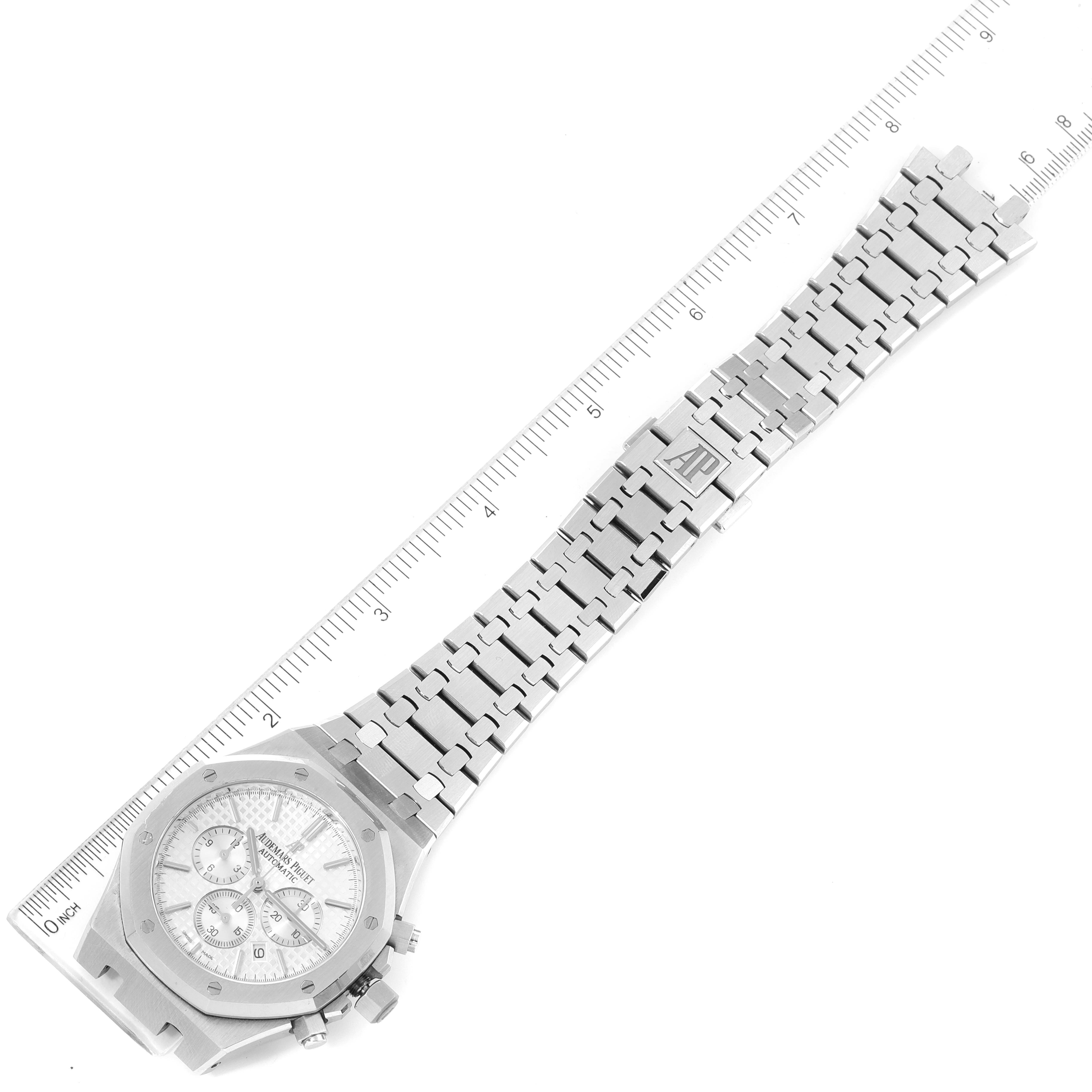 The image shows a top-down view of an Audemars Piguet Royal Oak 26320ST.OO.1220ST.02 Men's Stainless Steel Silver Dial 26320ST.OO.1220ST.02 Men's Stainless Steel Silver Dial watch, highlighting the watch face, bracelet, and clasp.