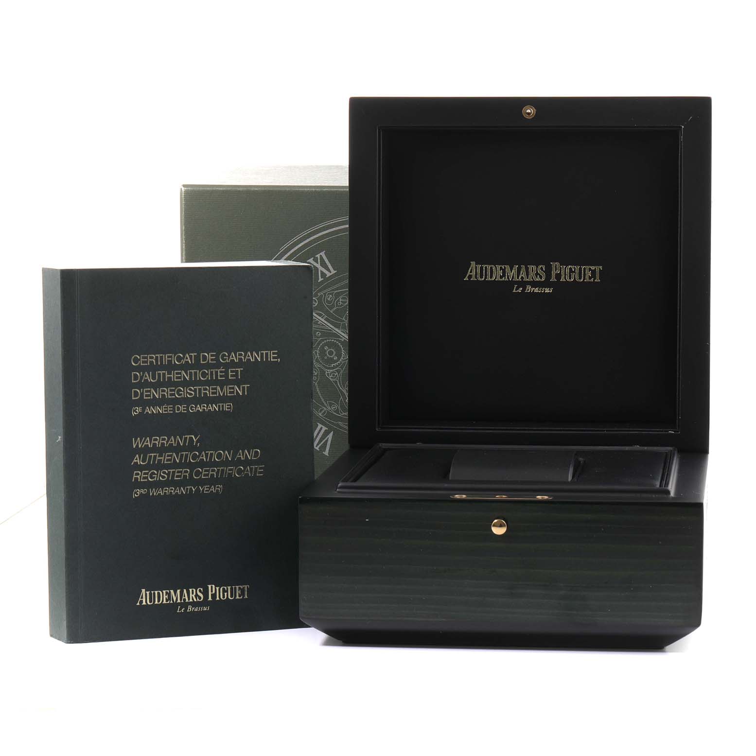 The image shows the open presentation box and warranty certificate of a Royal Oak watch by Audemars Piguet.