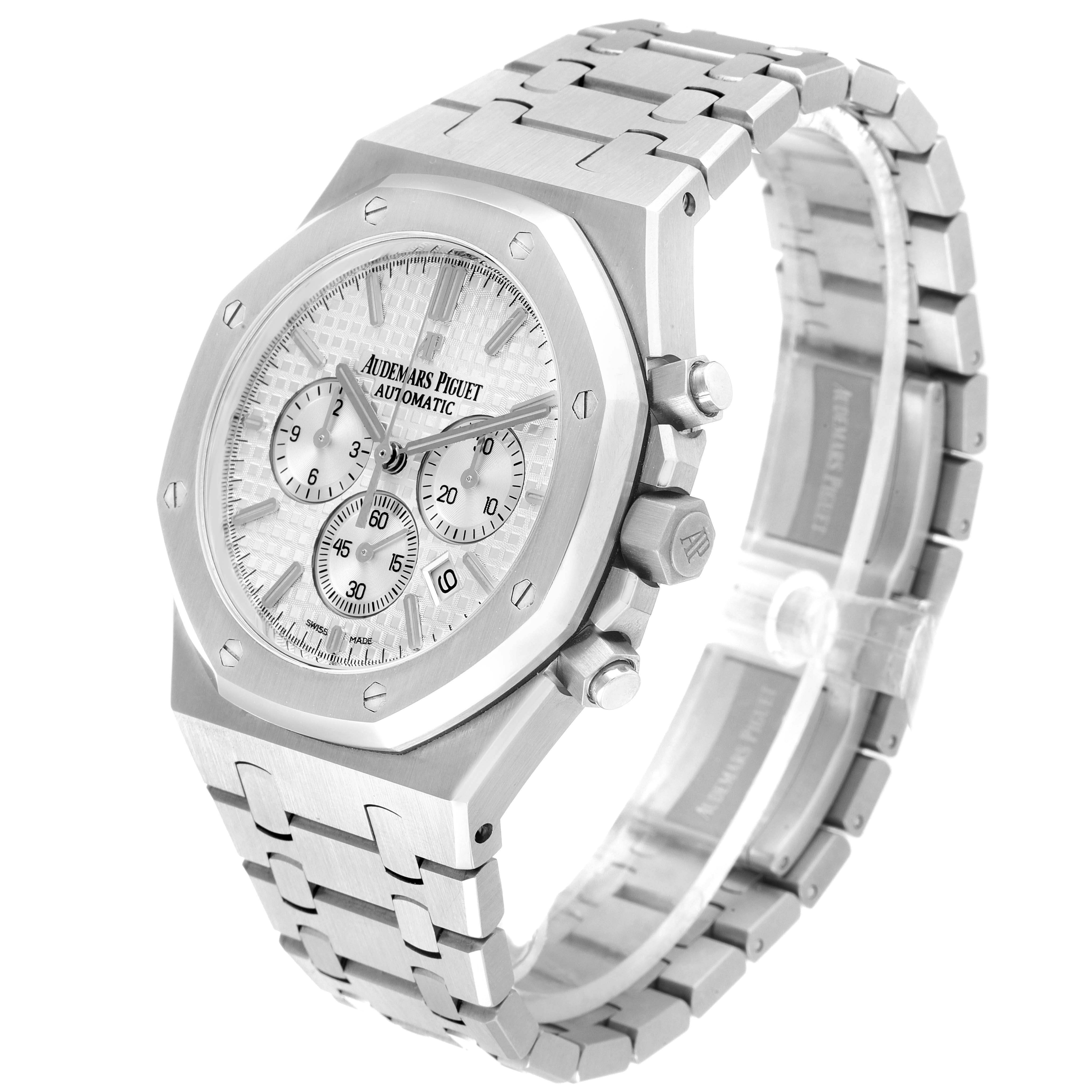 The image shows an angled view of the Audemars Piguet Royal Oak 26320ST.OO.1220ST.02 Men's Stainless Steel Silver Dial 26320ST.OO.1220ST.02 Men's Stainless Steel Silver Dial watch, displaying its face, bracelet, side buttons, and part of the clasp.