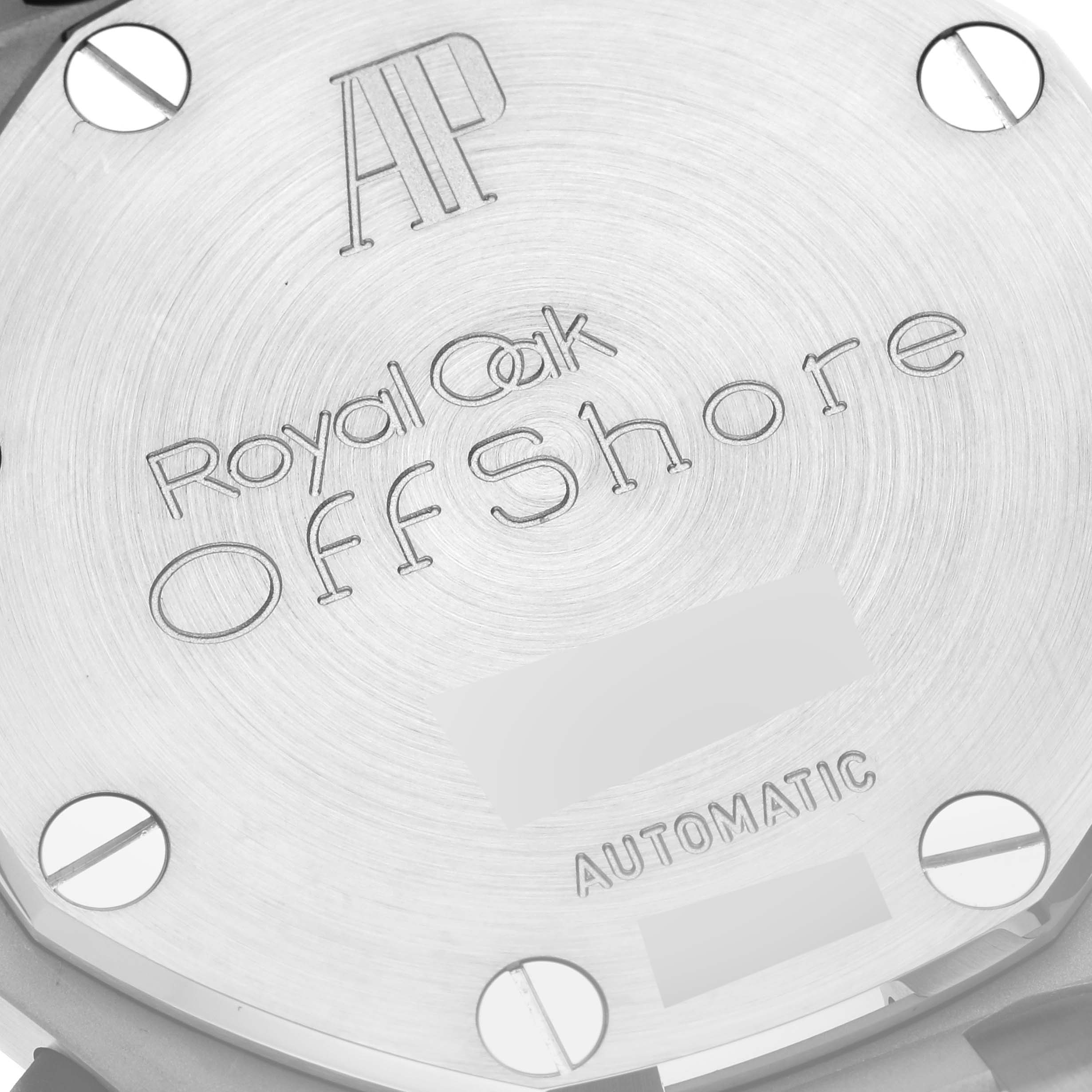 This image shows the case back of a Royal Oak Offshore model by Audemars Piguet, featuring engraved text and screws.