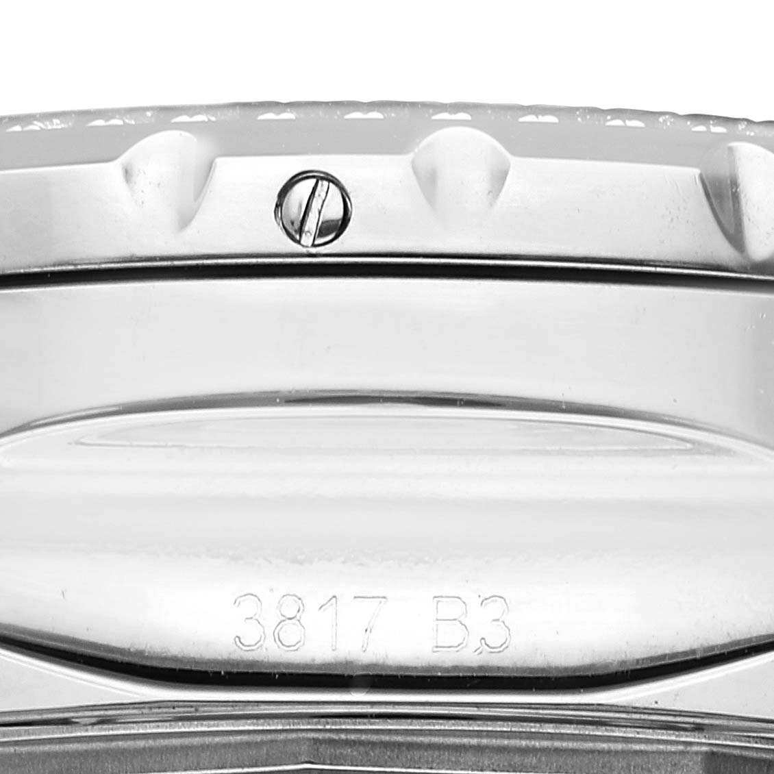 The image shows a close-up of the bezel and part of the casing with a screw and model number on the Bentley model by Breitling.