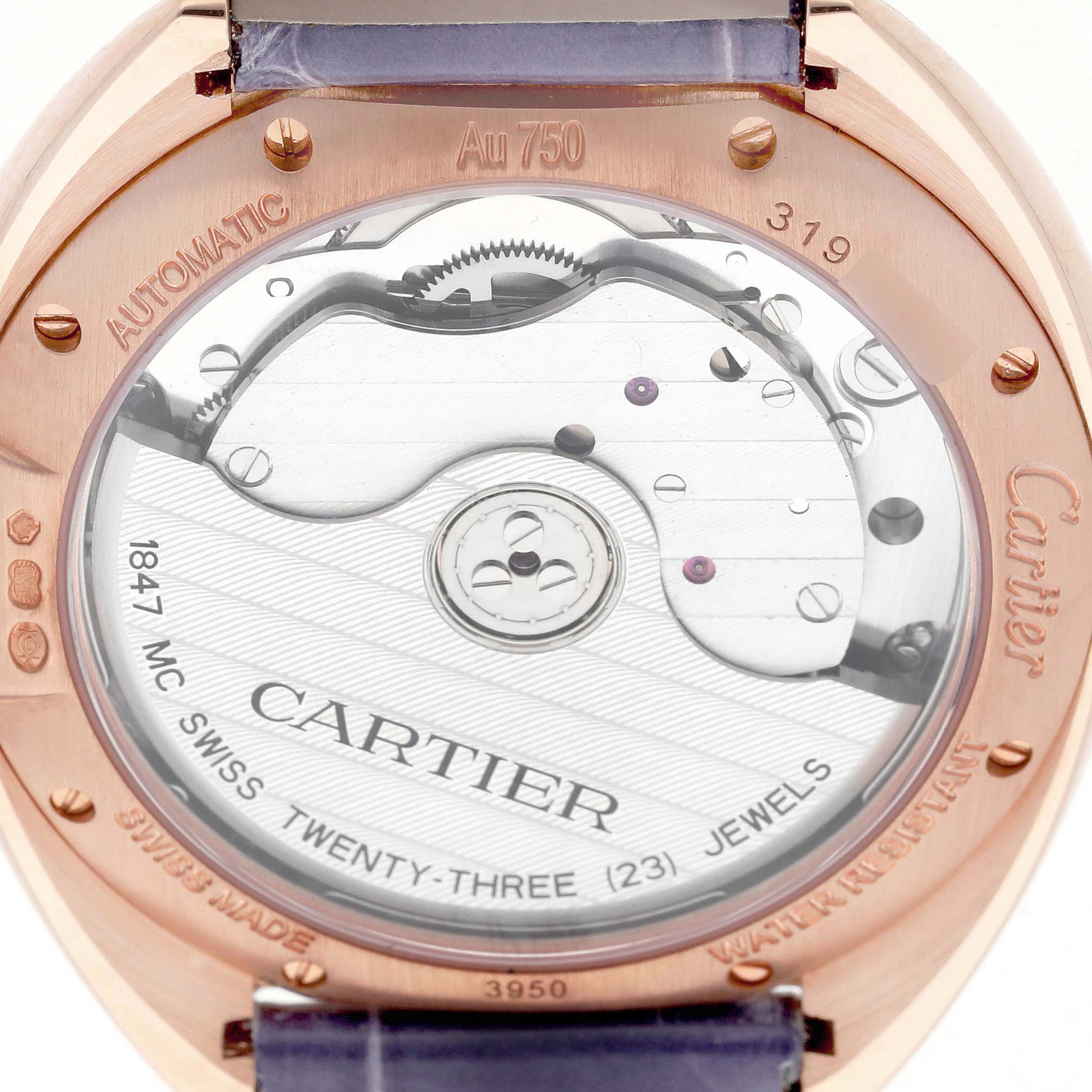 This image shows the back view of the Cartier Clé watch, highlighting its automatic movement and mechanical details.