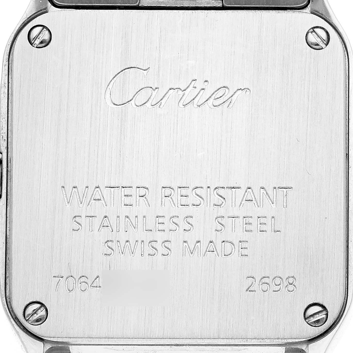 The image shows the back case of a Cartier Santos Demoiselle W25066Z6 Women
s Steel and Gold (two tone) Silver Dial W25066Z6 Women
s Steel and Gold (two tone) Silver Dial watch, featuring engraved details and four screws.