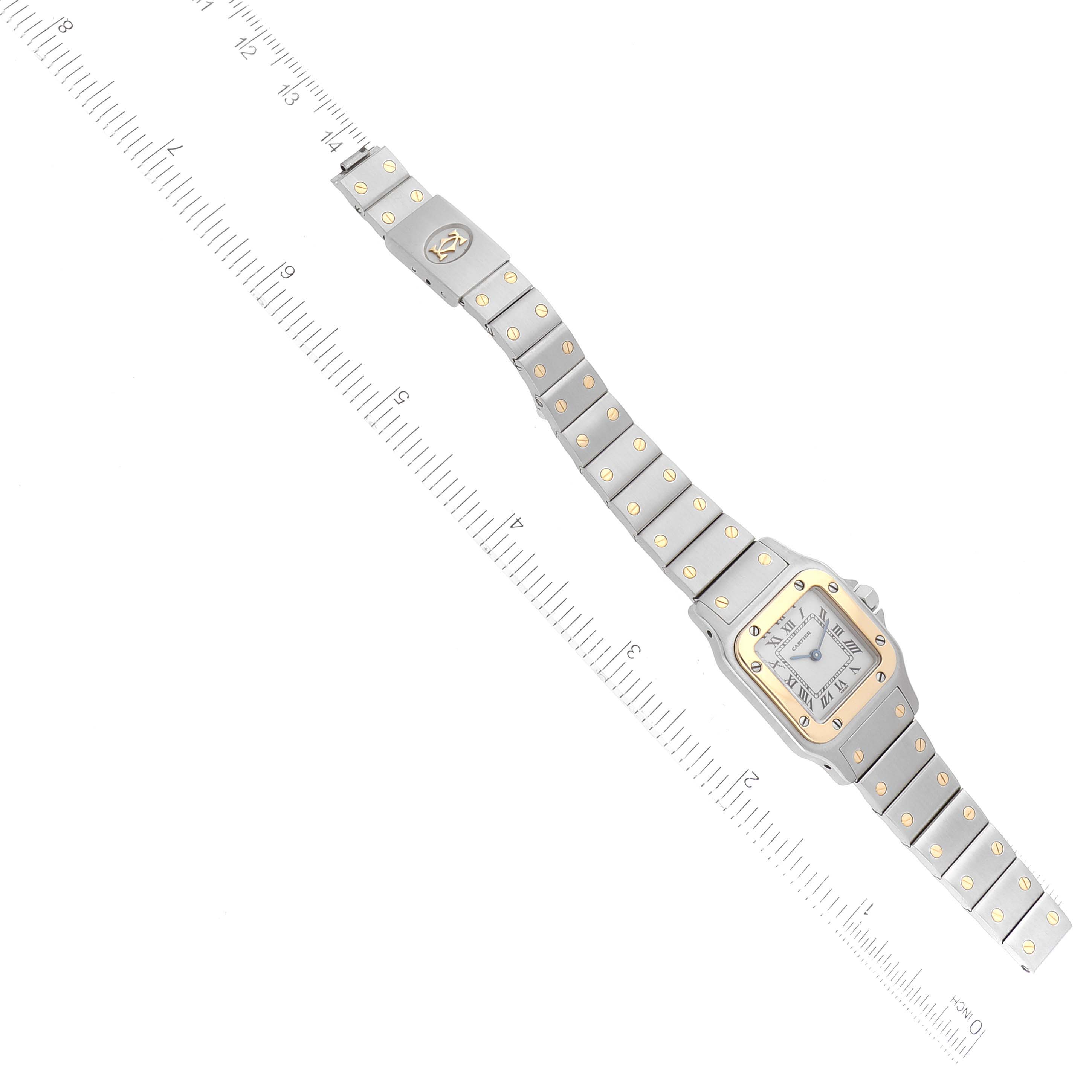 The Cartier Santos W20012C4 Women's Steel and Gold (two tone) Silver Dial W20012C4 Women's Steel and Gold (two tone) Silver Dial watch is shown in a top-down view, fully extended with a scale ruler for measurement.