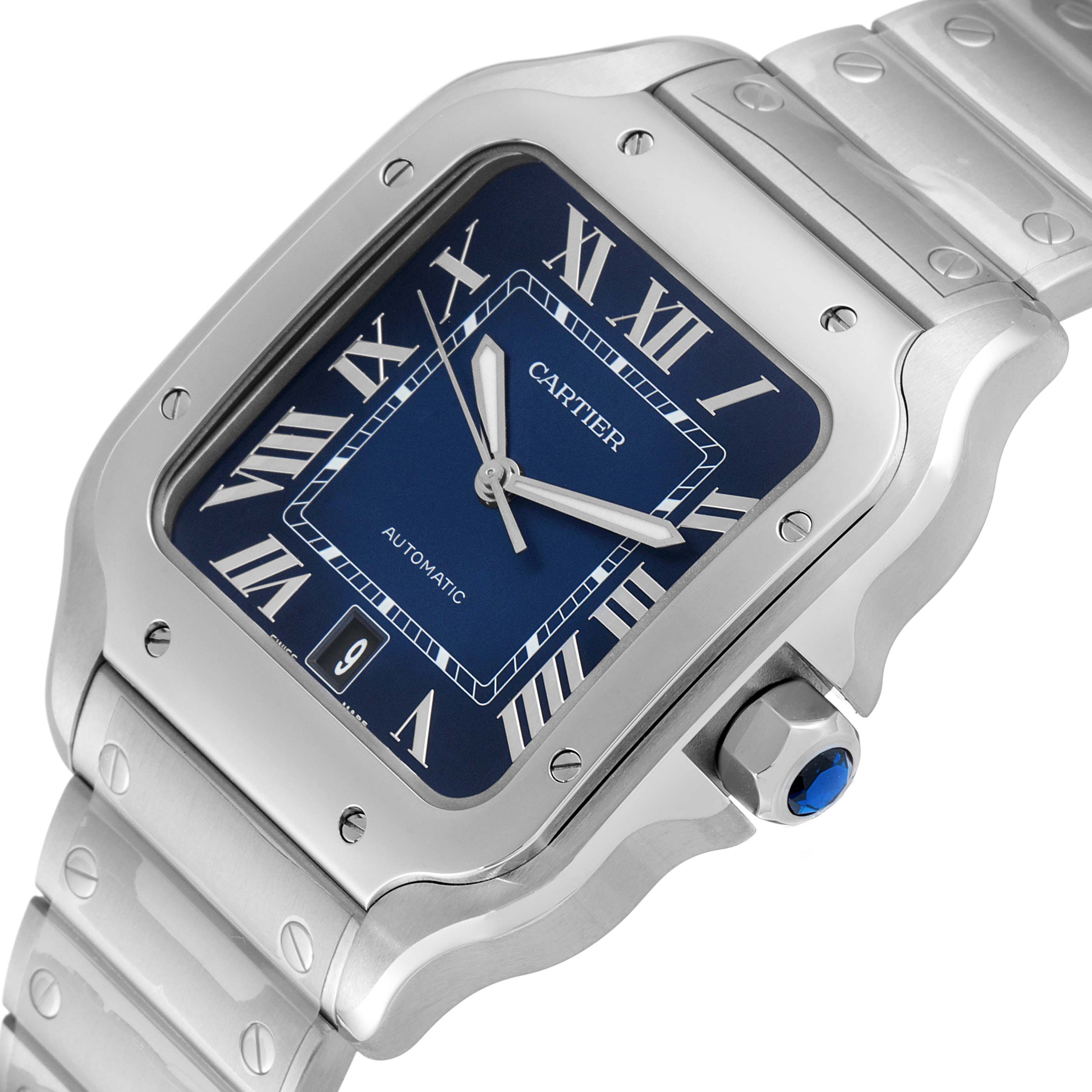 The Cartier Santos WSSA0030 Men's Stainless Steel Blue Dial WSSA0030 Men's Stainless Steel Blue Dial watch is shown at an angled close-up, displaying its blue dial, Roman numerals, bezel screws, and part of the bracelet.
