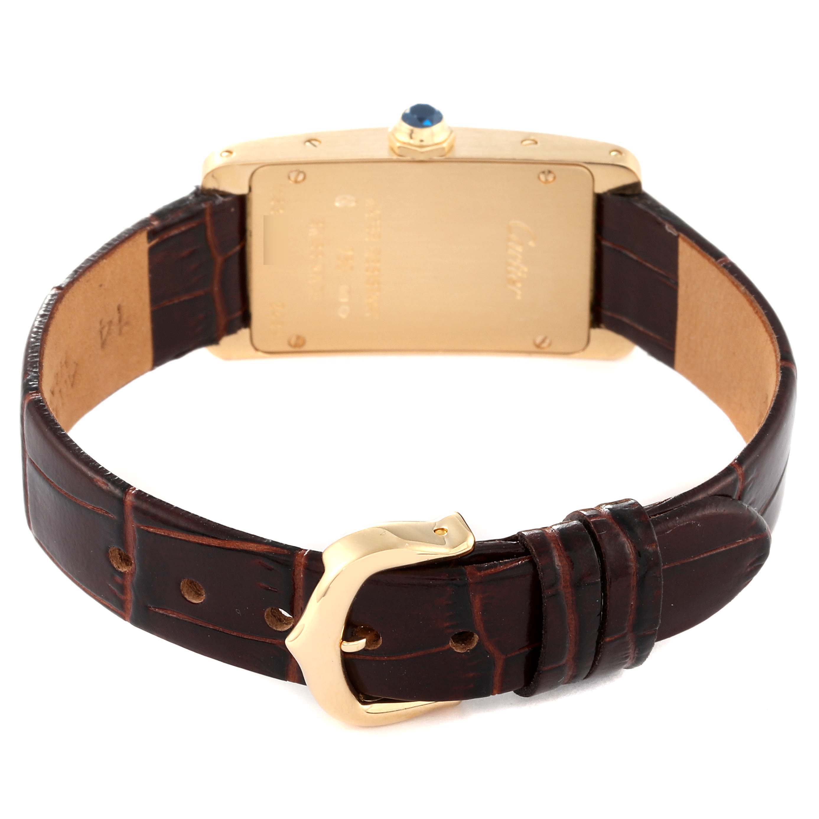 This image shows the back view of a Tank Americaine model by Cartier, highlighting the watch's case back, strap, and buckle.