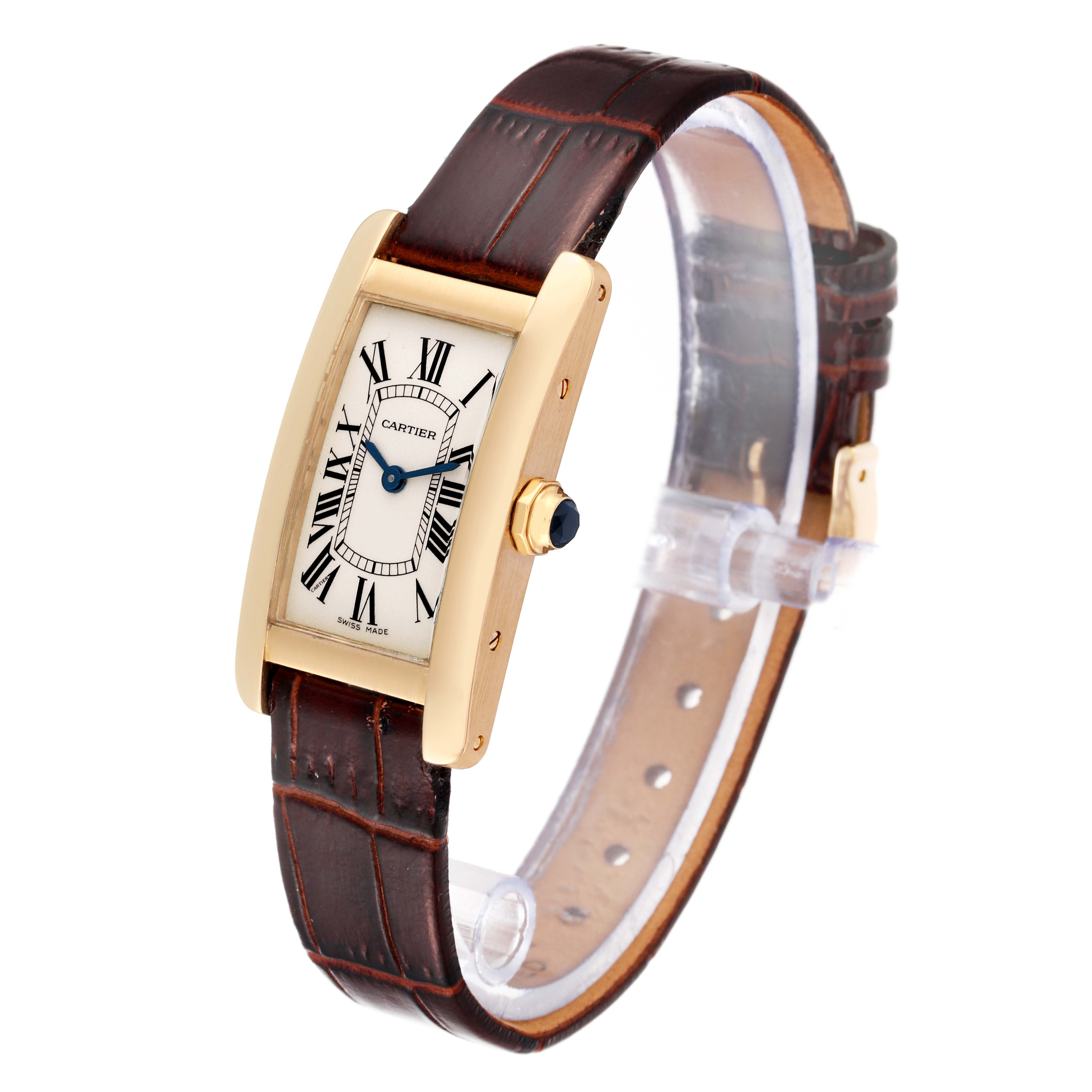 The Cartier Tank Americaine W26015K2 Women's Yellow Gold Silver Dial W26015K2 Women's Yellow Gold Silver Dial watch is shown at an angle displaying its face, strap, and crown.
