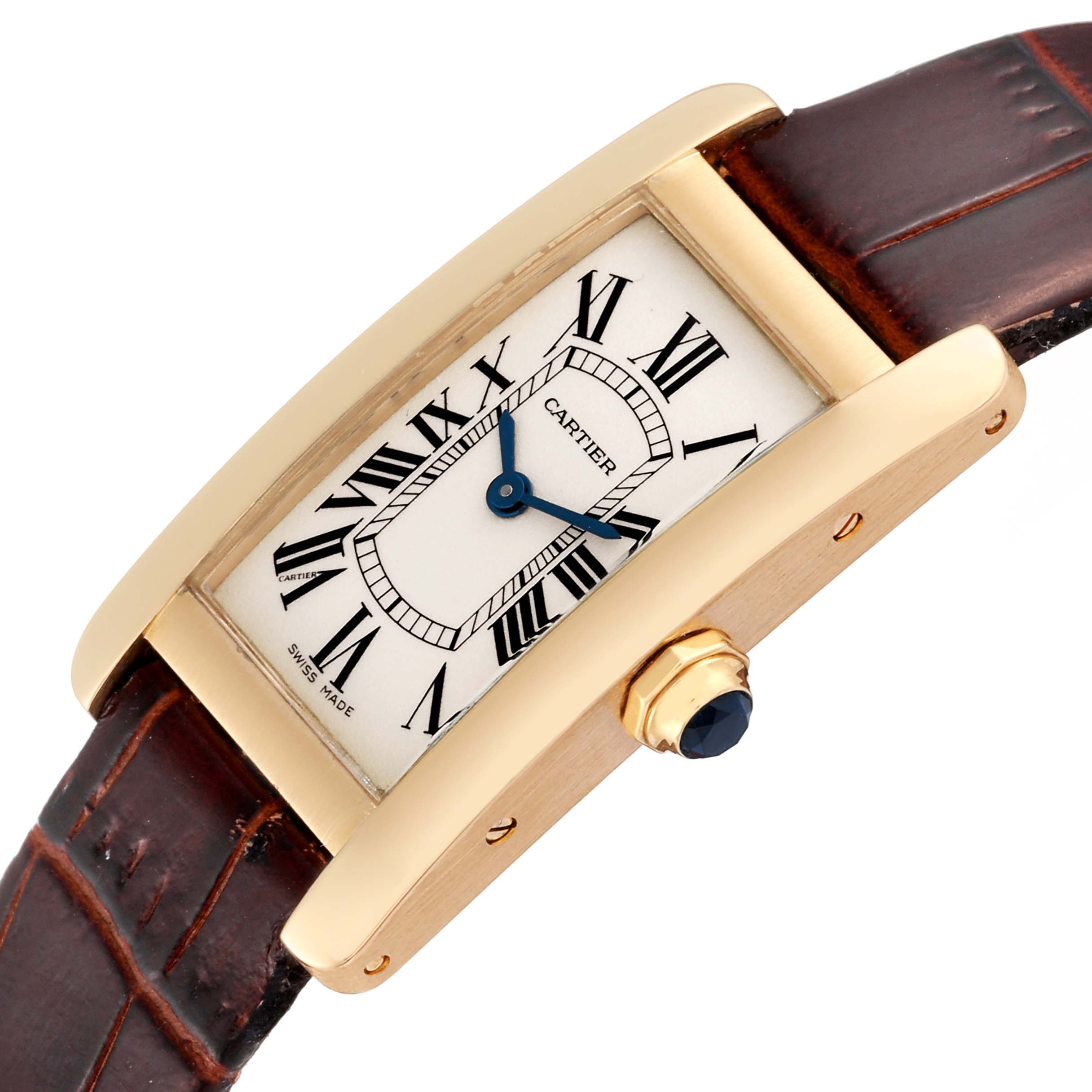 The image shows a close-up angle of the Cartier Tank Americaine W26015K2 Women's Yellow Gold Silver Dial W26015K2 Women's Yellow Gold Silver Dial watch face, crown, and a portion of the leather strap.