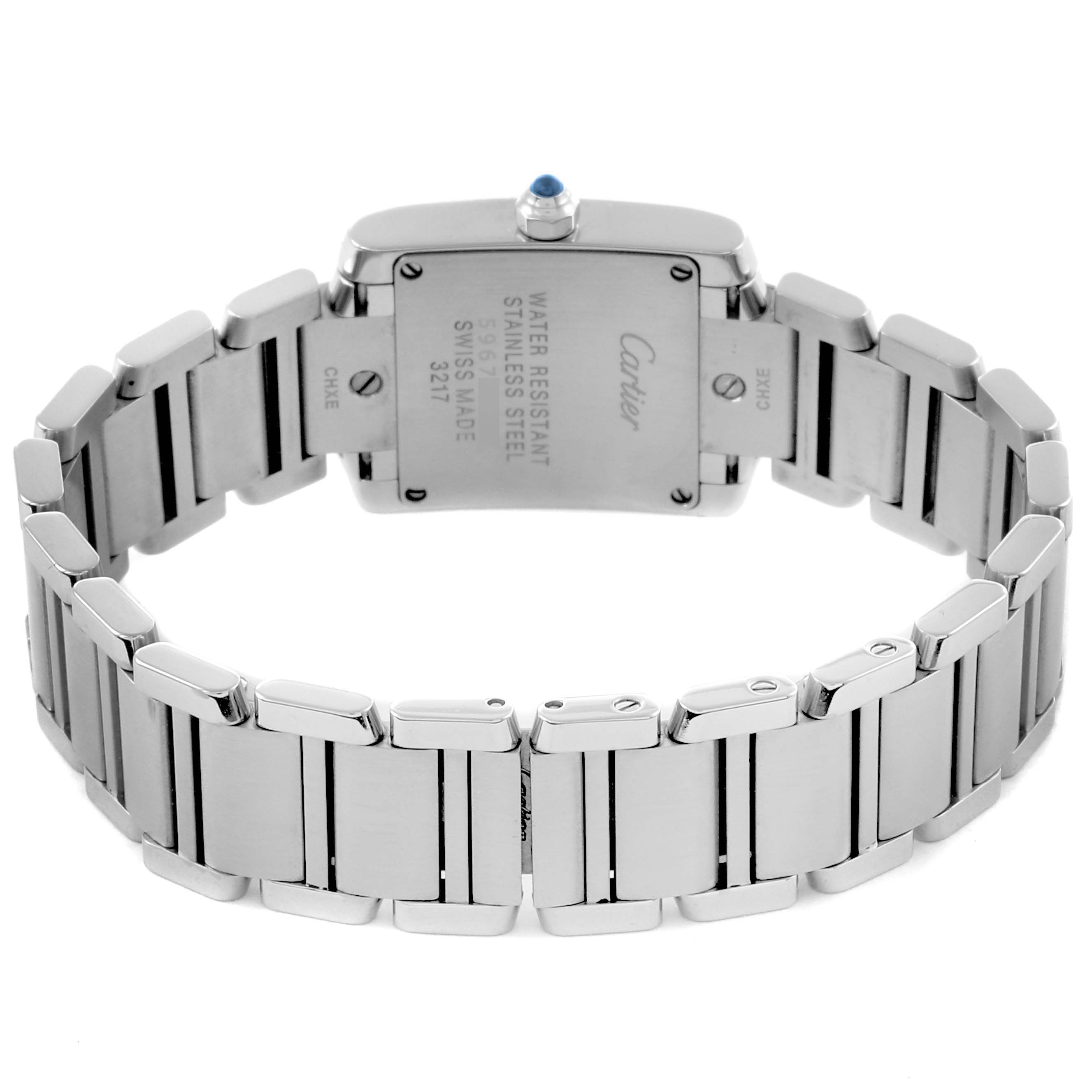 The Cartier Tank Française watch is shown from the back, highlighting the stainless steel case and linked bracelet.