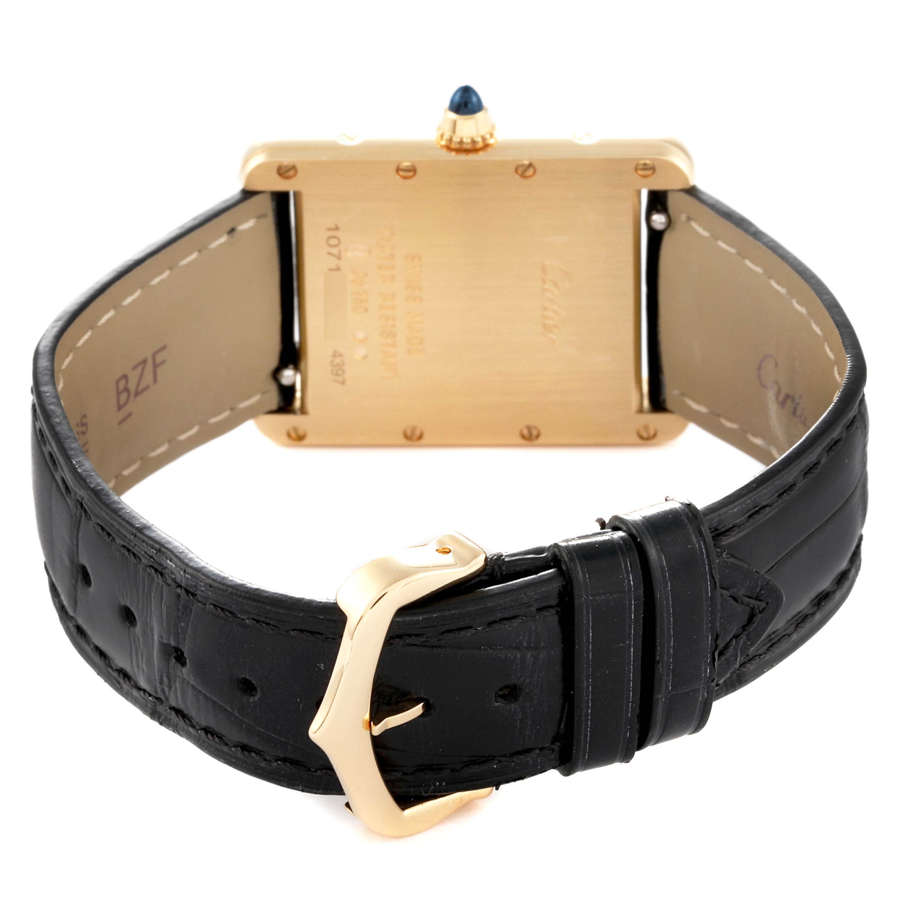 This image shows the back view of the Cartier Tank Louis WGTA0067 Men's Yellow Gold Silver Dial WGTA0067 Men's Yellow Gold Silver Dial watch, highlighting the leather strap, case back, and buckle.