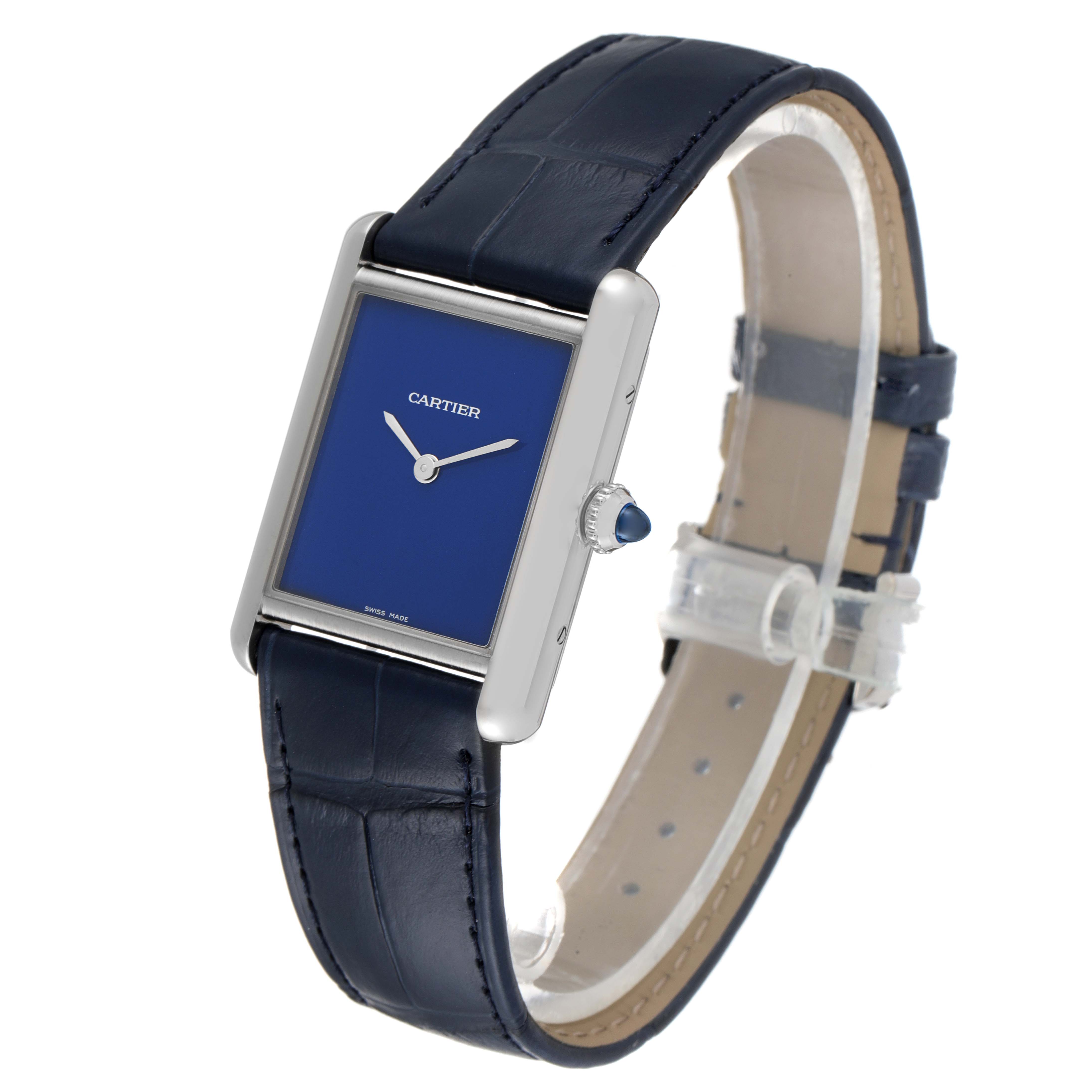 The Cartier Tank Must WSTA0055 Women's Stainless Steel Blue Dial WSTA0055 Women's Stainless Steel Blue Dial watch is shown at a slight angle, displaying its blue face, silver case, and blue leather strap.
