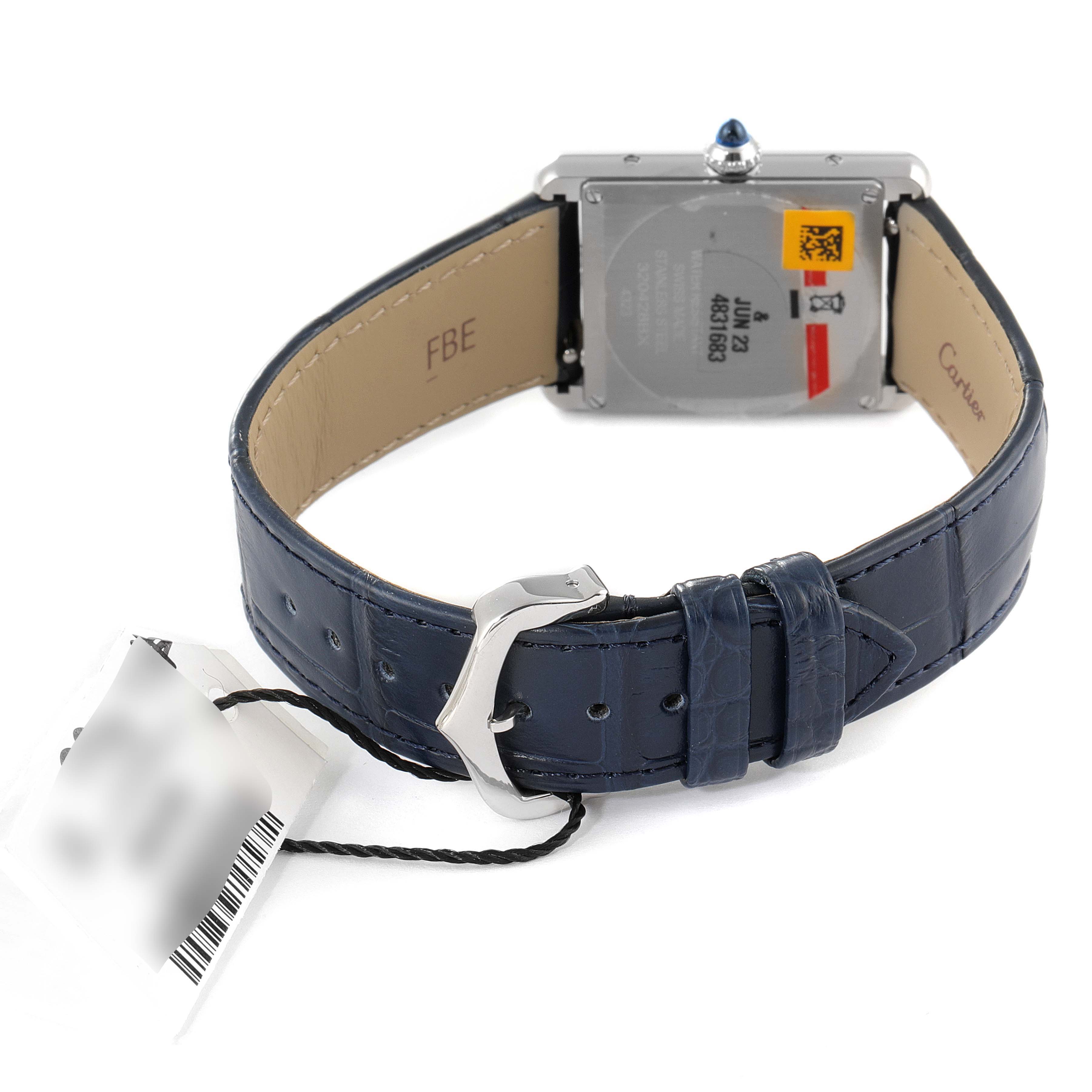 The image shows the back of a Cartier Tank Must WSTA0055 Women's Stainless Steel Blue Dial WSTA0055 Women's Stainless Steel Blue Dial watch, highlighting the strap, buckle, and case back.
