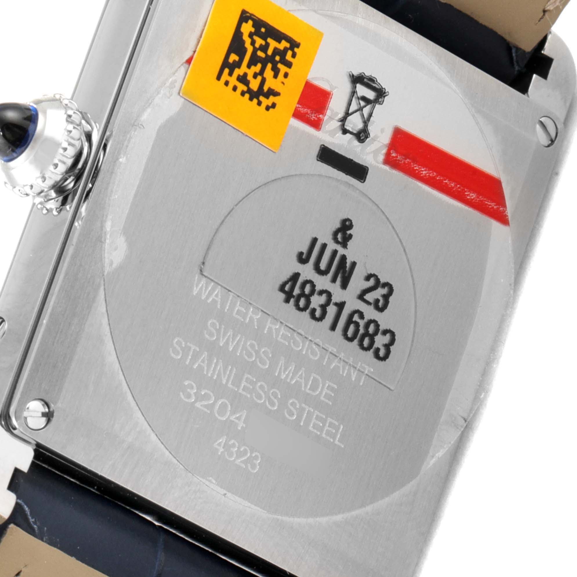 The image shows the back of a Cartier Tank Must WSTA0055 Women's Stainless Steel Blue Dial WSTA0055 Women's Stainless Steel Blue Dial watch, displaying its engravings and stainless steel case.