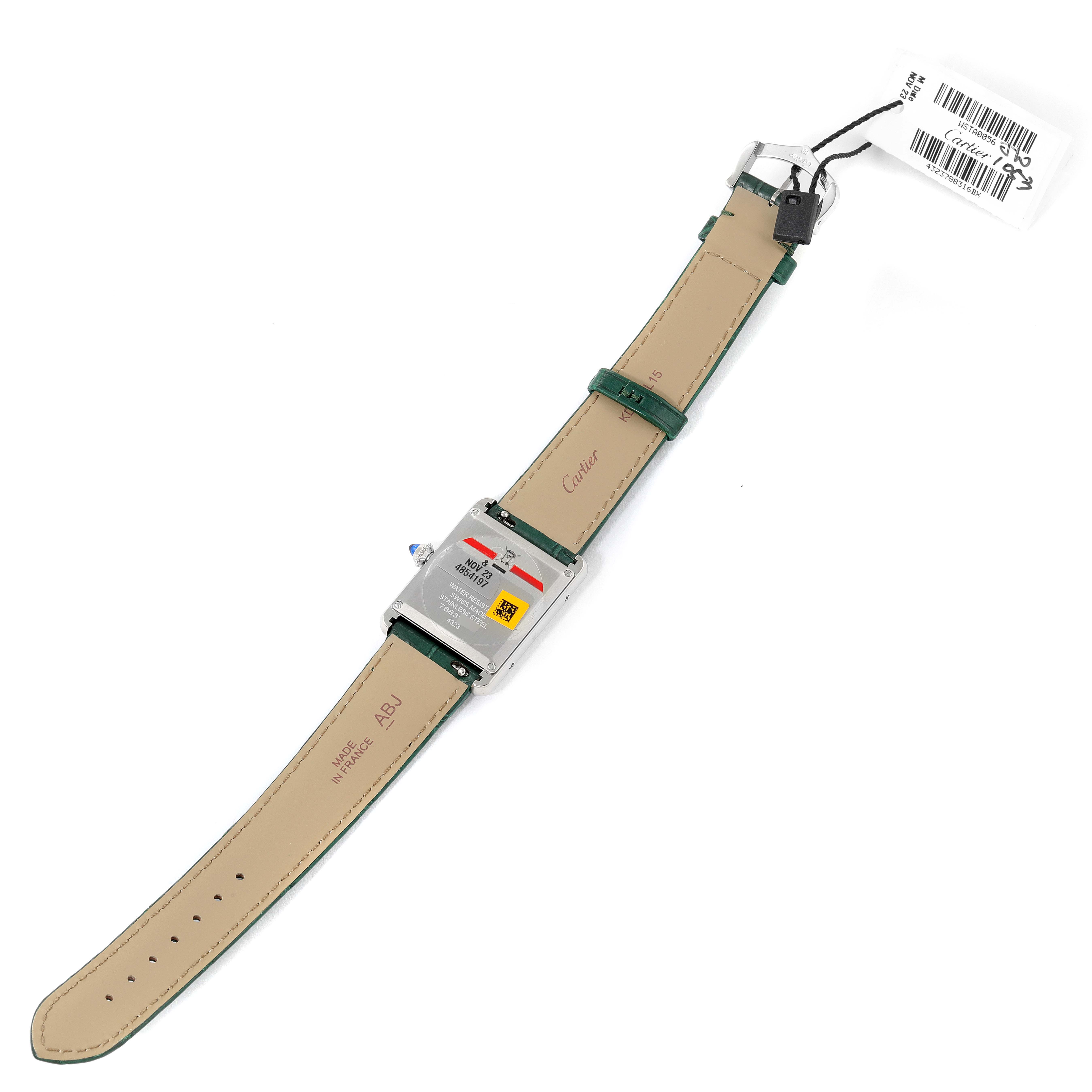 The image shows the back of the Cartier Tank Must WSTA0056 Women's Stainless Steel Green Dial WSTA0056 Women's Stainless Steel Green Dial watch with its green leather strap laid flat.